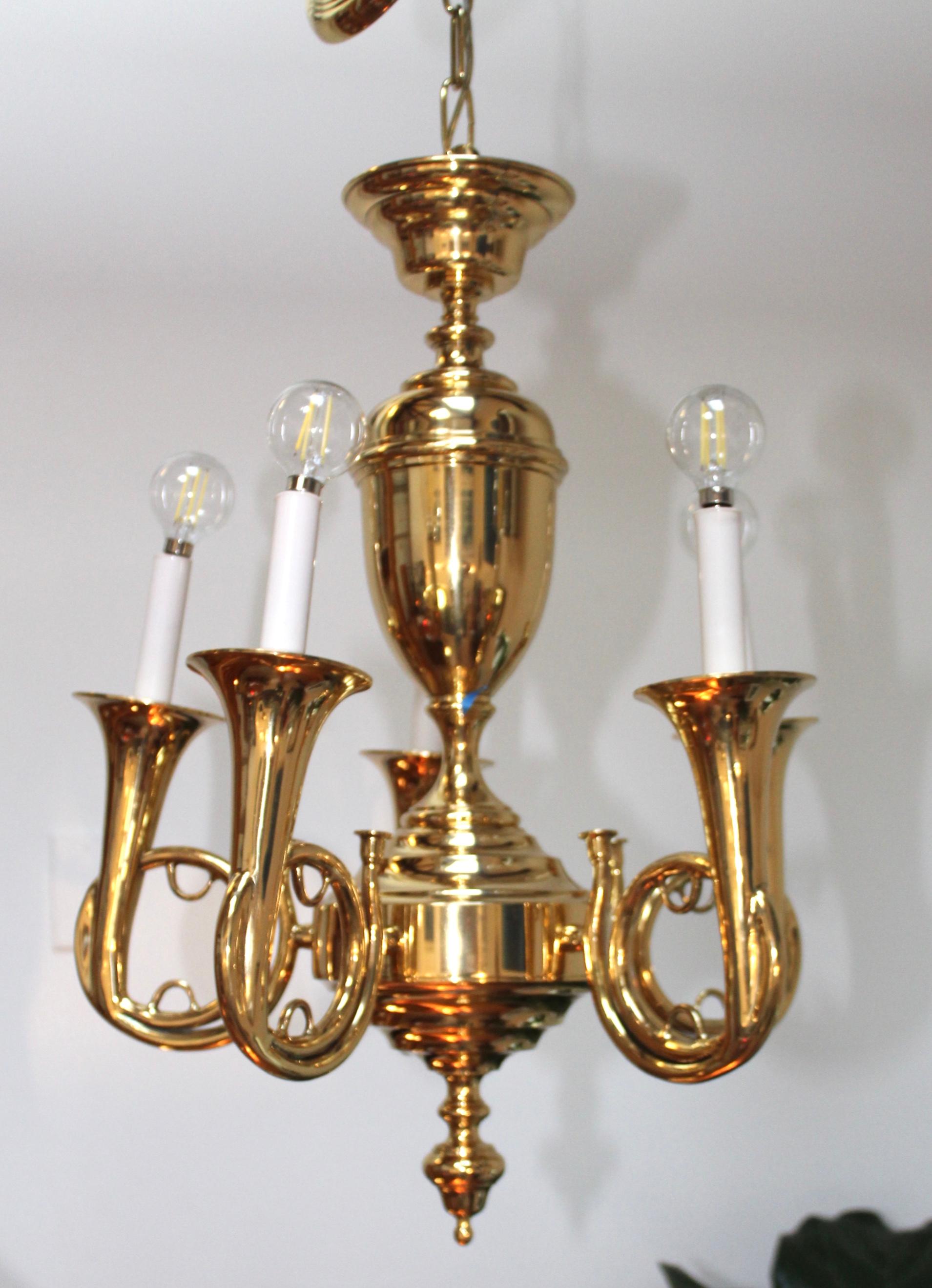 1970s modern trumpet brass chandelier by Chapman.

Height can be adjusted.