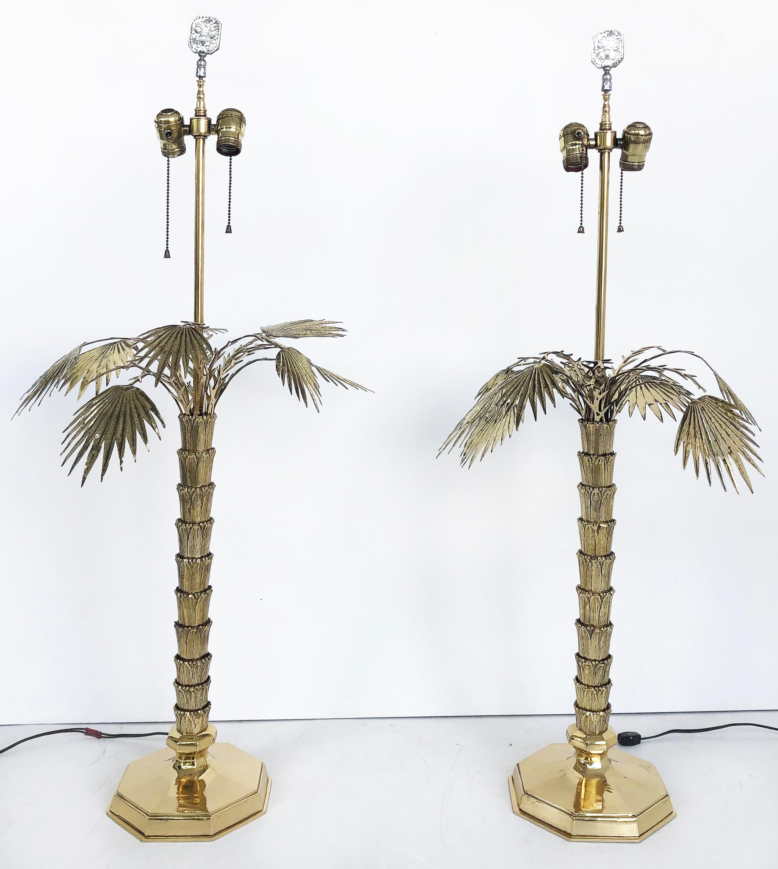 1970s Chapman Brass Palm Tree table lamps, pair

Offered for sale is a pair of Chapman brass palm tree table lamps c1970. The lamps are wired and in working condition. They accommodate two standard bulbs, have pull chains and in-line power