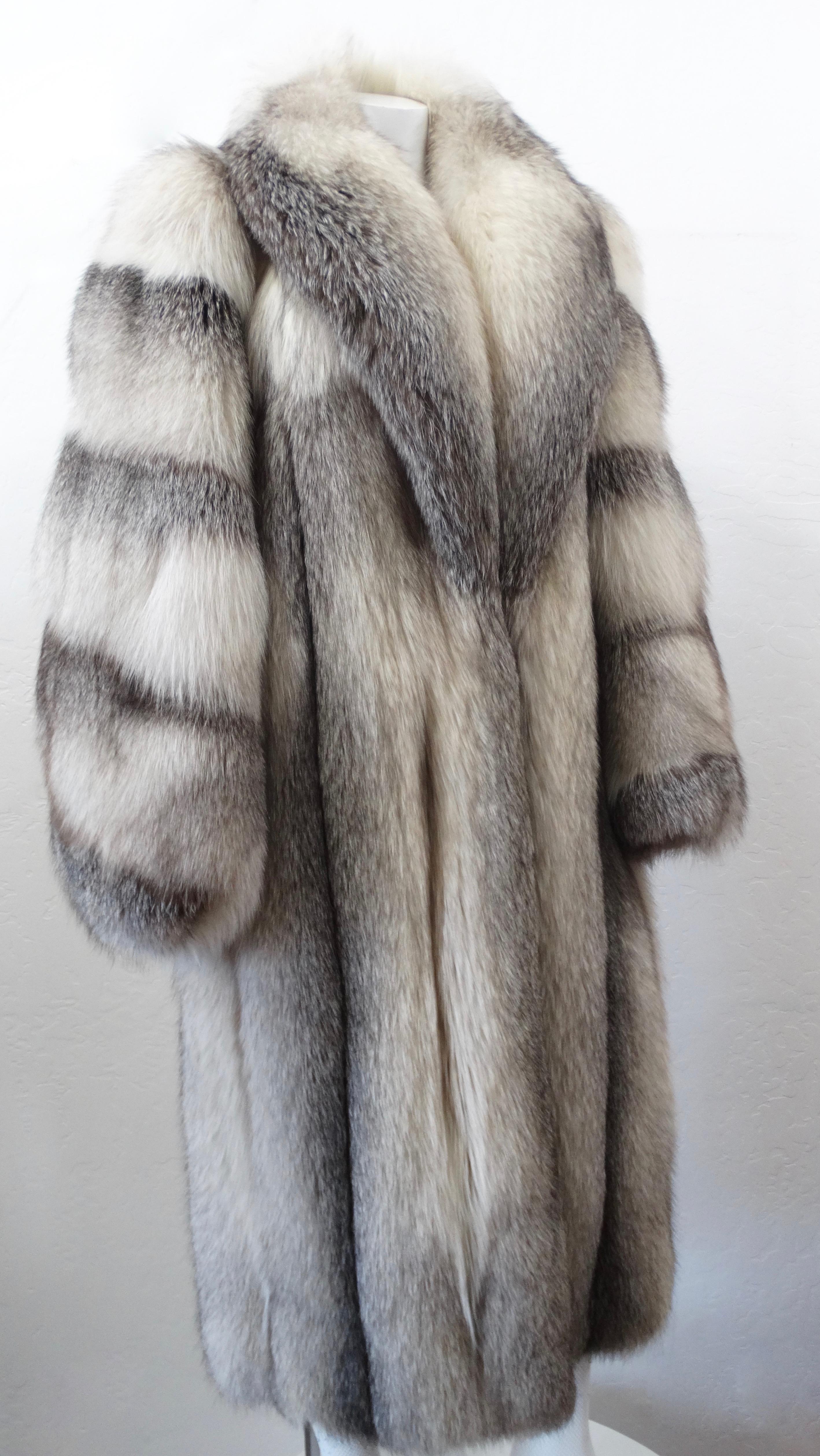 Radiate 1970s glam with this amazing fur coat! Designed by Charles Calfun, this billowy fur puffer coat is made of ultra soft grey fox fur and features a shawl collar. Interior is fully lined. Guaranteed to keep you warm while staying fabulous! 