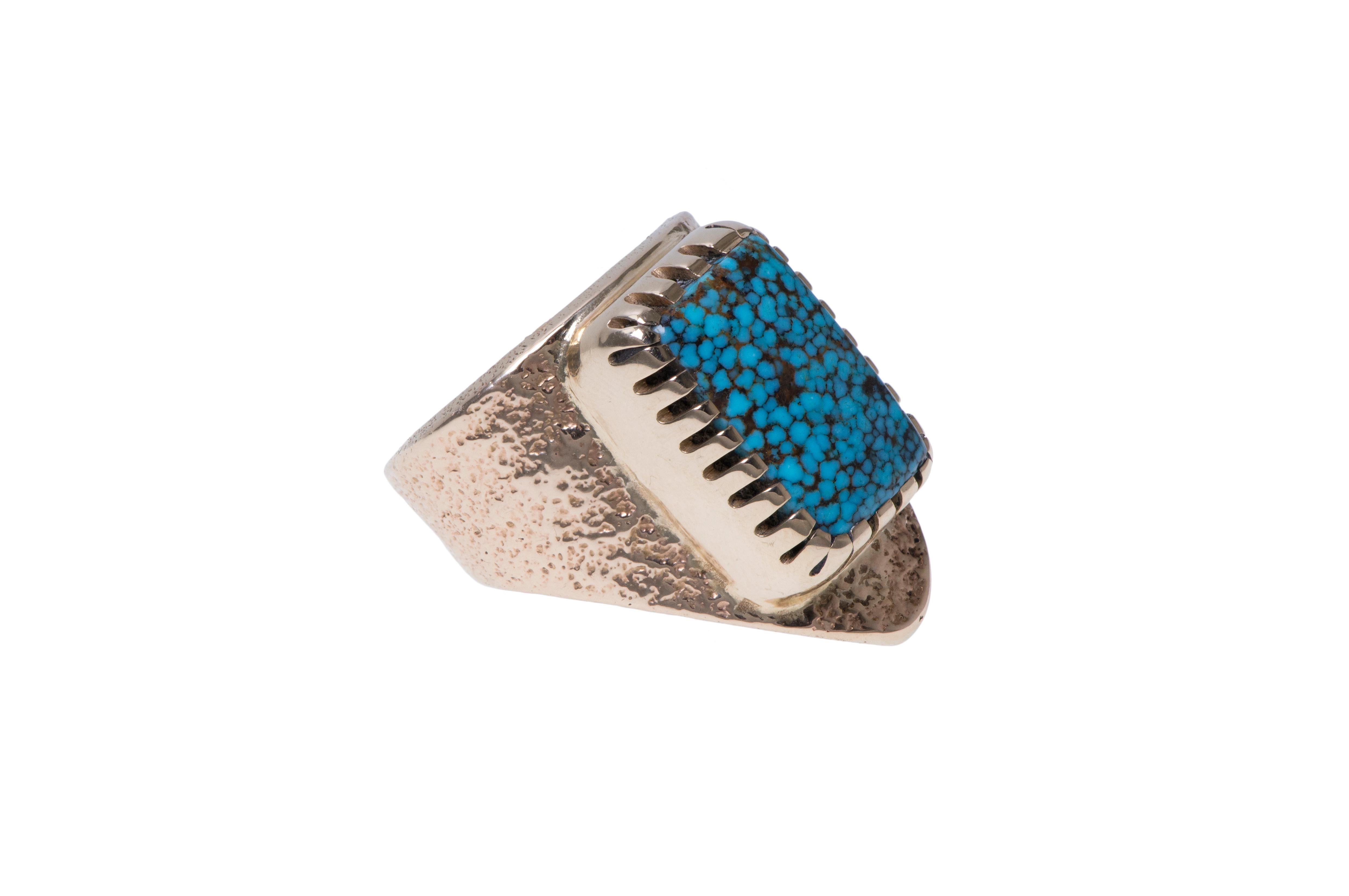 An authentic,  one-of-a-kind, finely crafted, and highly collectible, Nevada Blue turquoise and tufa cast 14 karat gold ring, with interior exposed turquoise, by Hopi modernist master Charles Loloma, c. 1975. 

The ring is a size 7.75 and is stamped
