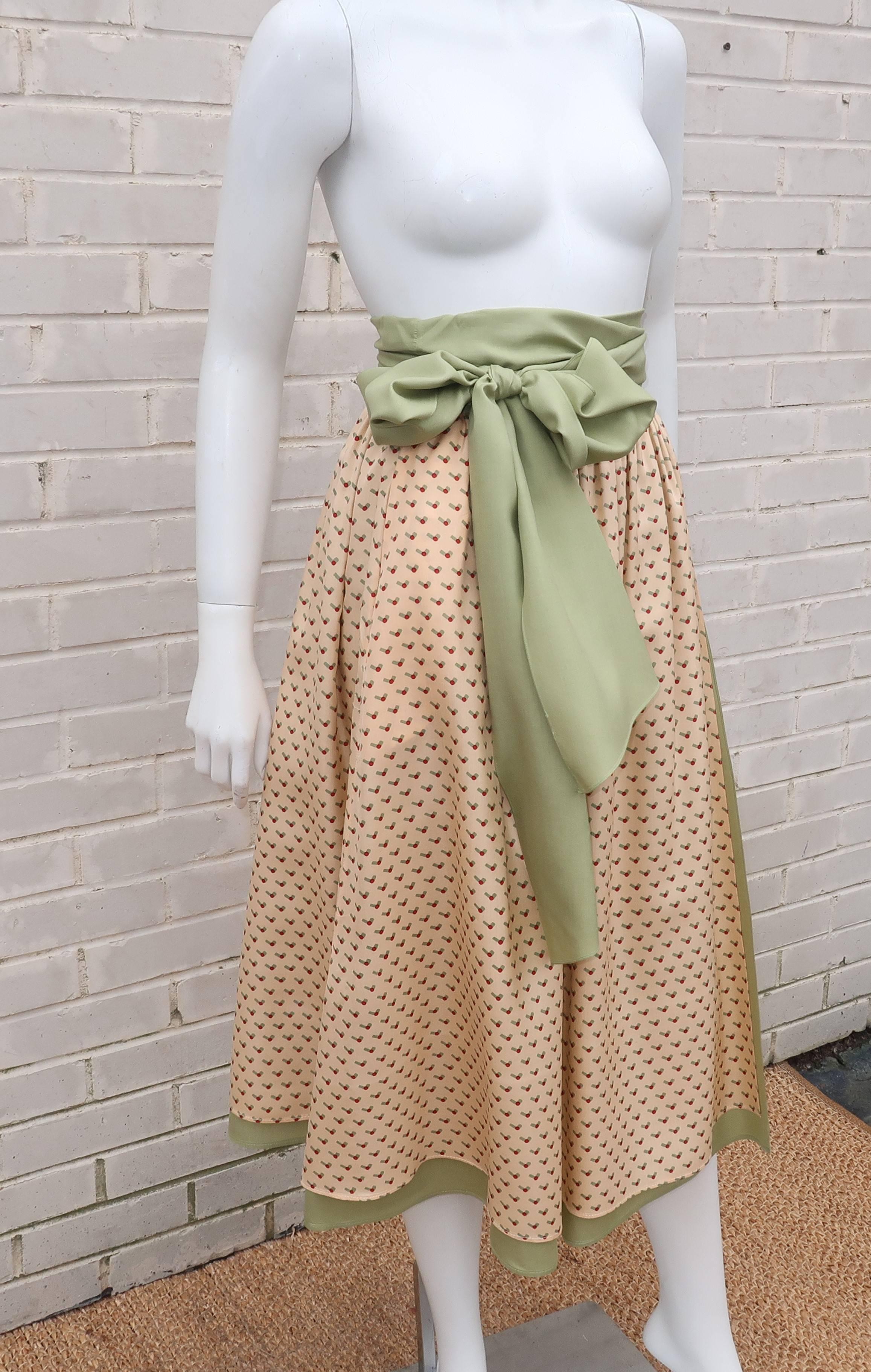 Wrapped in charm!  This 1970's Don Sophisticates silk wrap skirt designed by Charlotte Ford is a breath of fresh air.  The skirt combines two layers of silk ... one layer of sage green topped with an abstract cherry micro-print which introduces red