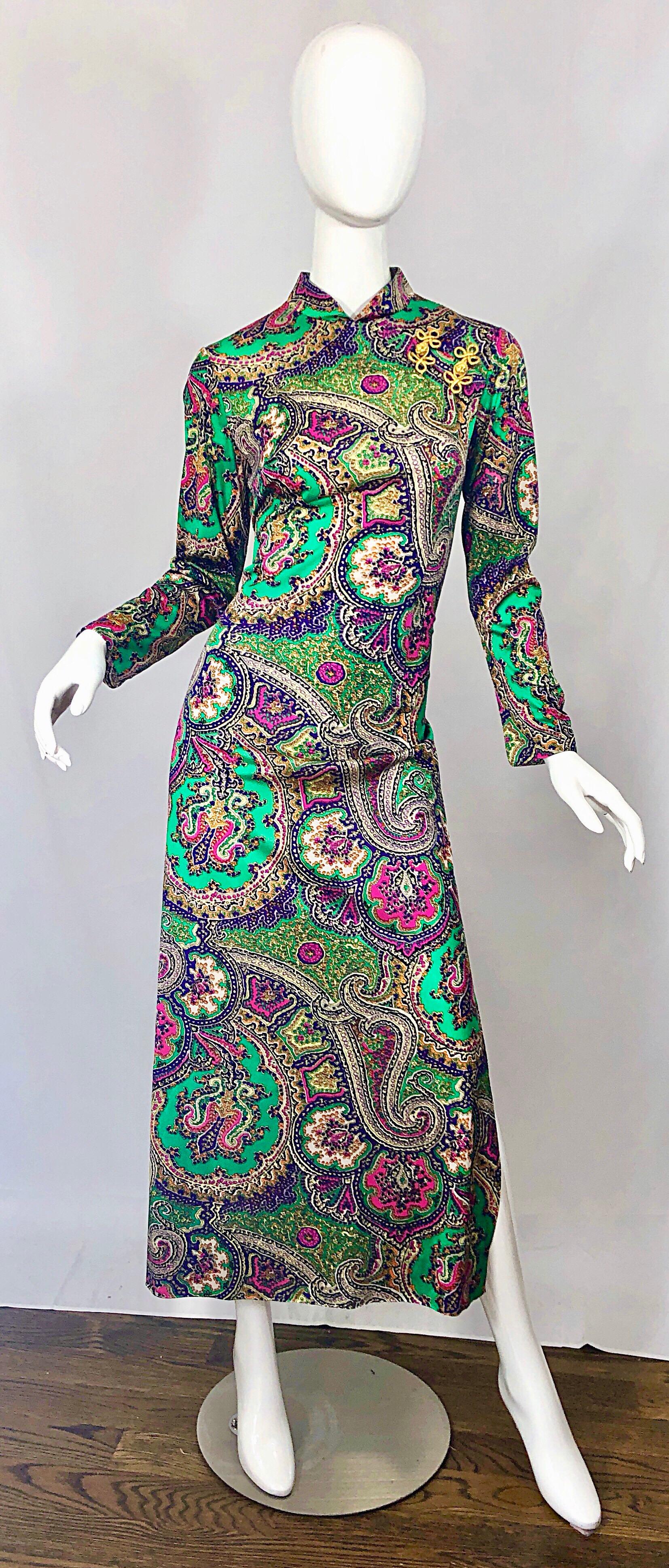 Incredible vintage 70s cheongsam Asian inspired colorful paisley print jersey maxi dress! Features metallic gold embroidery at top left shoulder. Vibrant colors of kelly green, purple, pink, fuchsia and white throughout. Full metal zipper up the