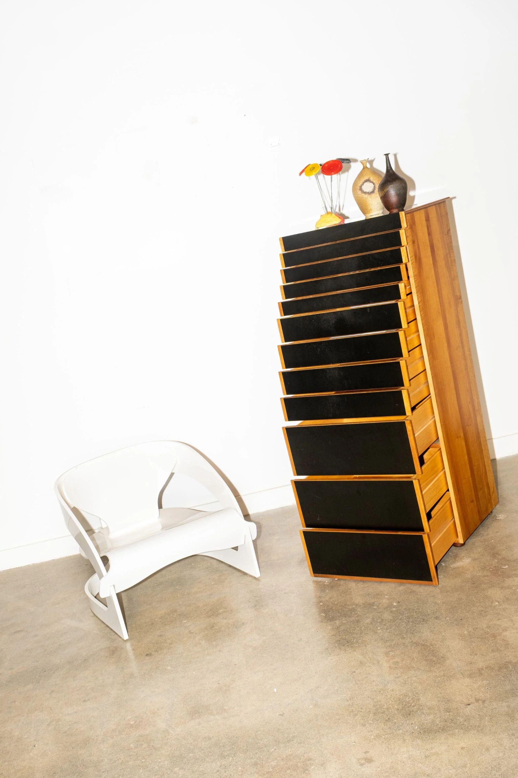 Multilayer wood veneered chest of drawers in cherry wood, laminated. Varied drawer sizes; those at top include dividers/compartments. Designed by legends Afra & Tobia Scarpa, and produced by Stildomus. What a very chic way to file your papers.