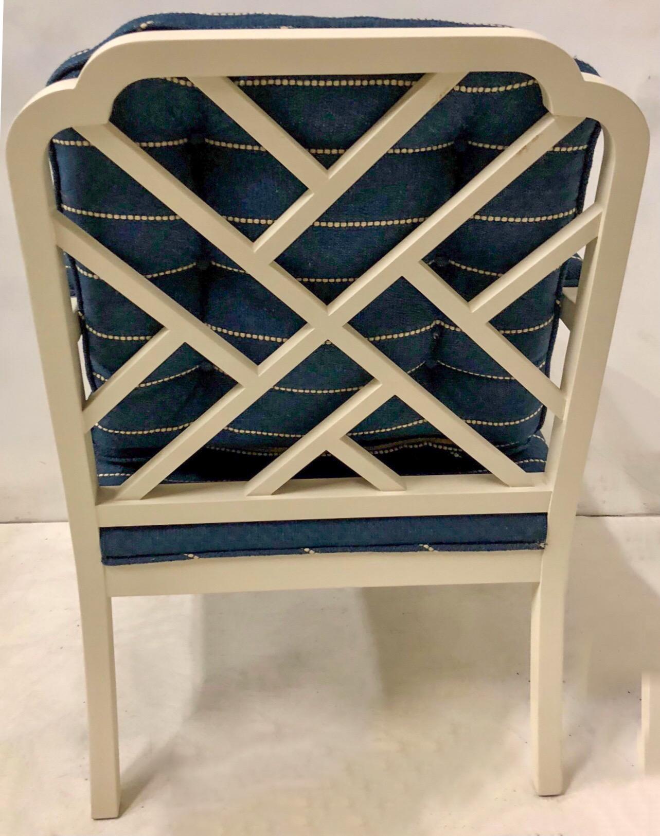 These Erwin Lambeth chairs date to the 1970s. They have Chinese chippendale styling and have been given a fresh update with a satin linen white paint and textured linen upholstery. They are marked and in very good condition. See the available