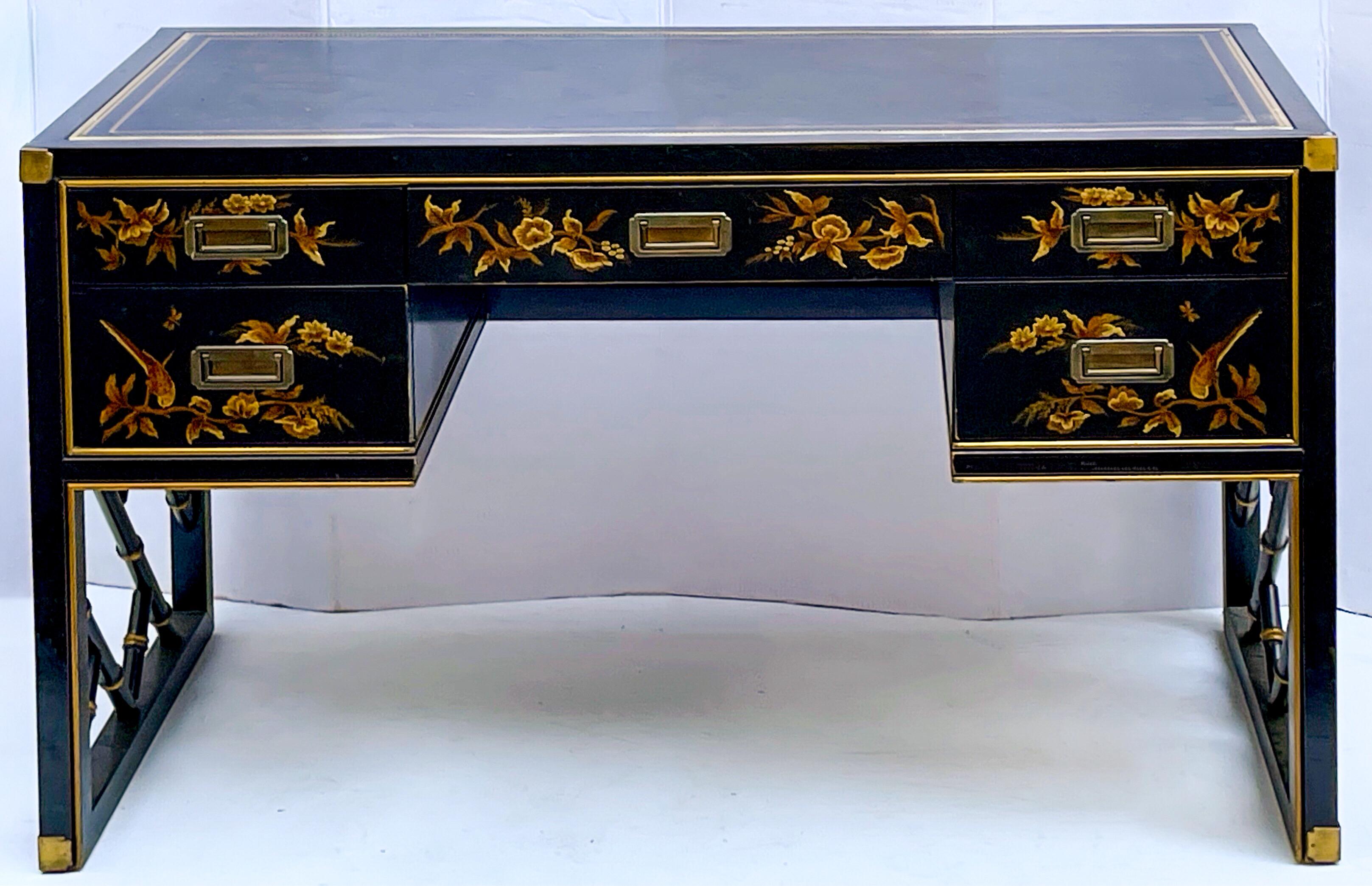 Love this! This is a leather top desk by Sligh Furniture that combines chinoiserie and campaign styling to make a bold statement piece! It is marked and in very good condition. The desk can float in a room as it is painted on all sides.