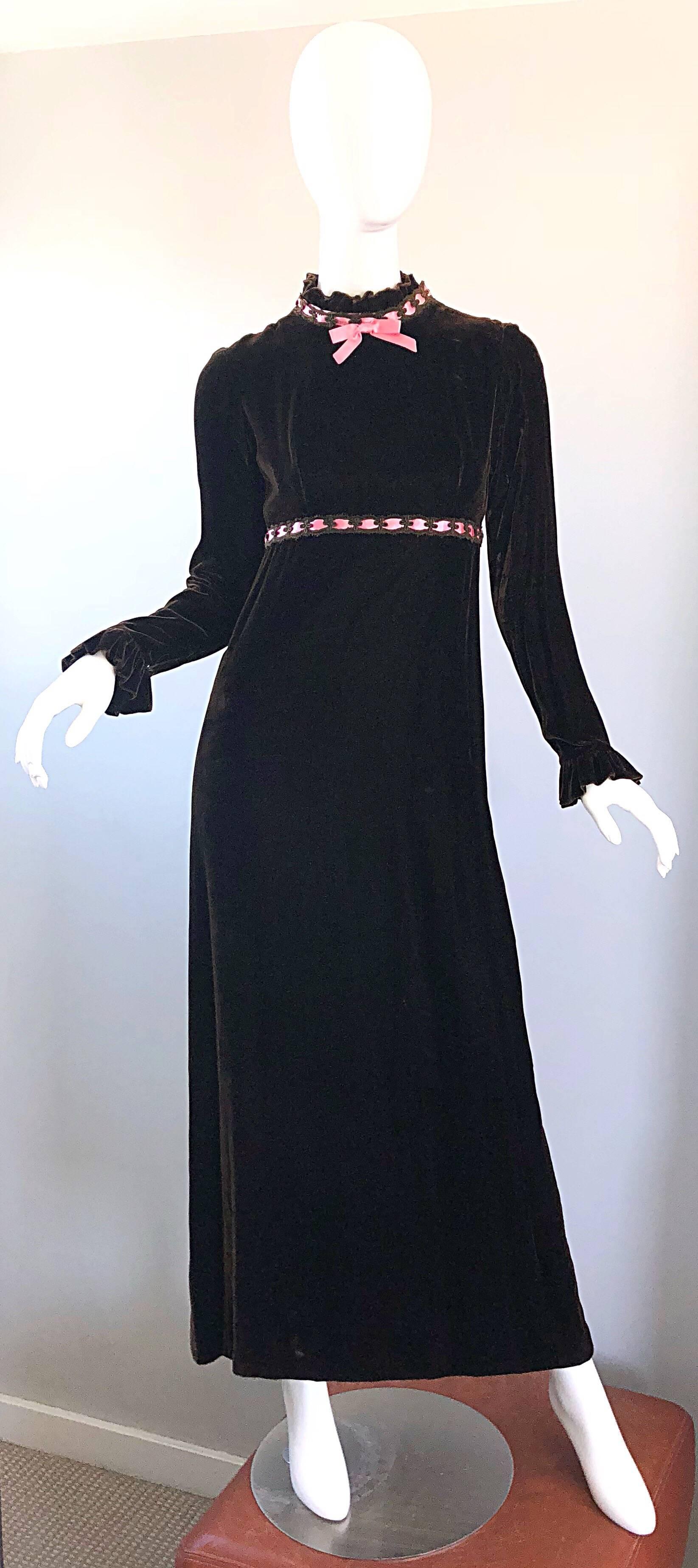 Gorgeous 1970s chocolate brown and pink silk velvet evening gown! Features a chic Victorian inspired high neck. Bubblegum pink ribbon on the collar and empire waist. Sleek long sleeves feature ruffled cuffs with hidden snaps. Full metal zipper up
