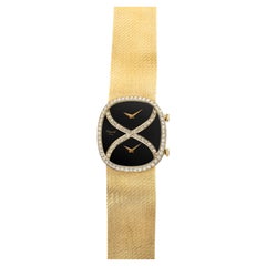 1970s Chopard Dual Time 18K Yellow Gold Onyx Diamond Dial Manual 30mm