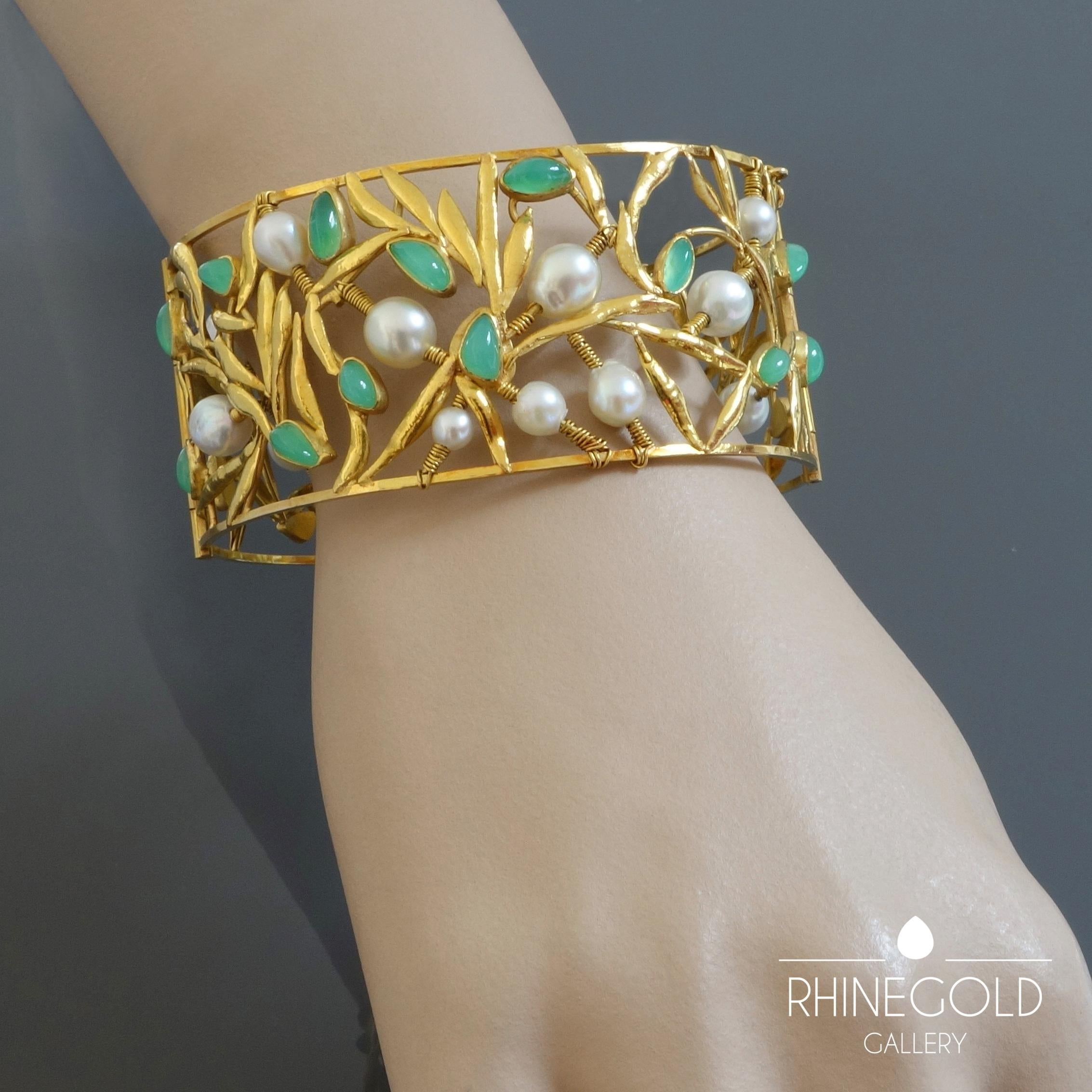1970s Christel Dix Modernist Floral Chysoprase Pearl Gold Bangle 
18k yellow gold, chrysoprase, cultured pearls
Inner circumference 20.2 cm (approx. 7 15/16“), width 3.65 cm (approx. 1 7/16”)
Weight approx. 48.2 grams
Marks: maker’s mark, gold