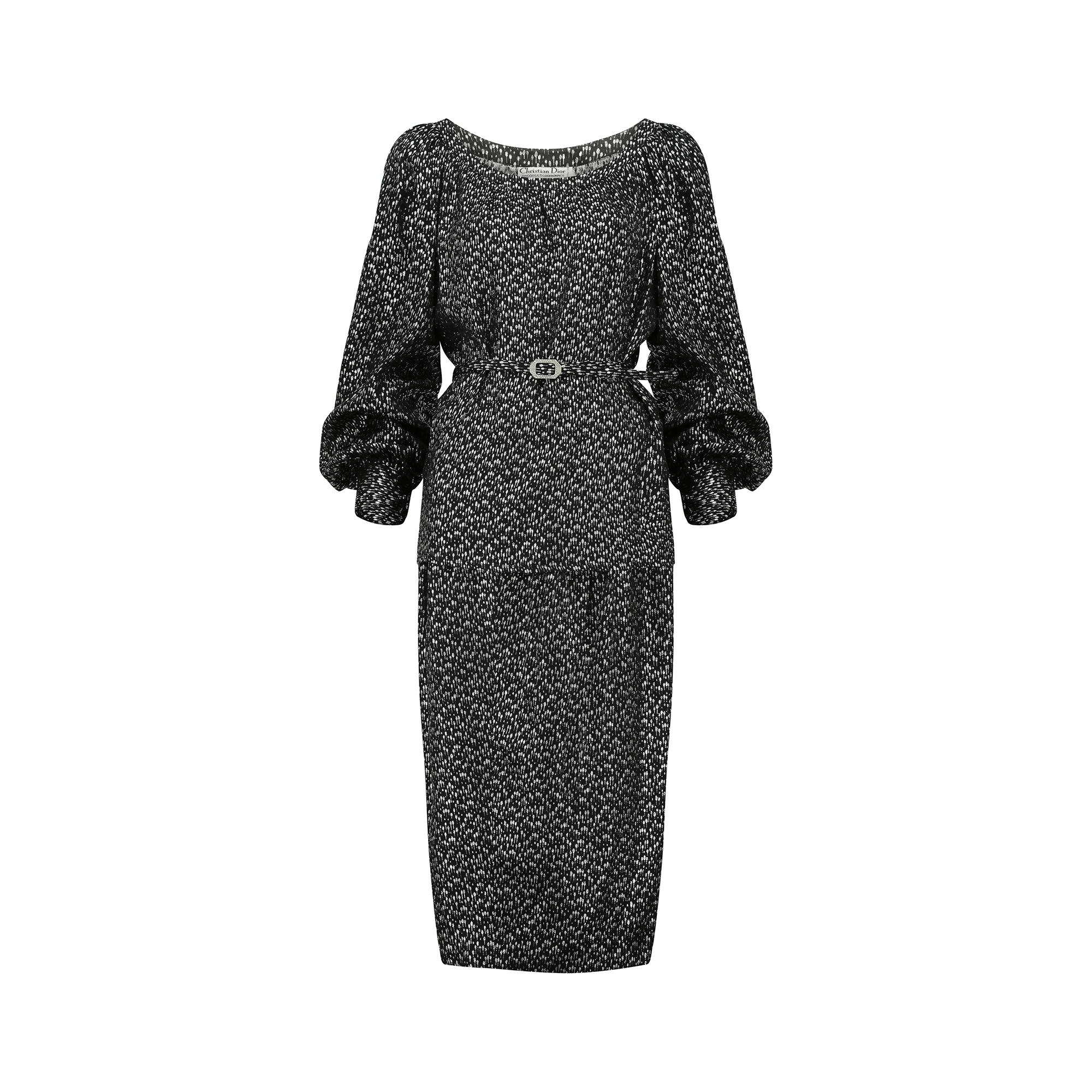 This Christian Dior set is from the late 1970s to early 1980s and made from a metallic black and silver lightweight silk lame.  The design of the weave has an almost celestial look - oval spots with the larger of the two sizes having a small tail,