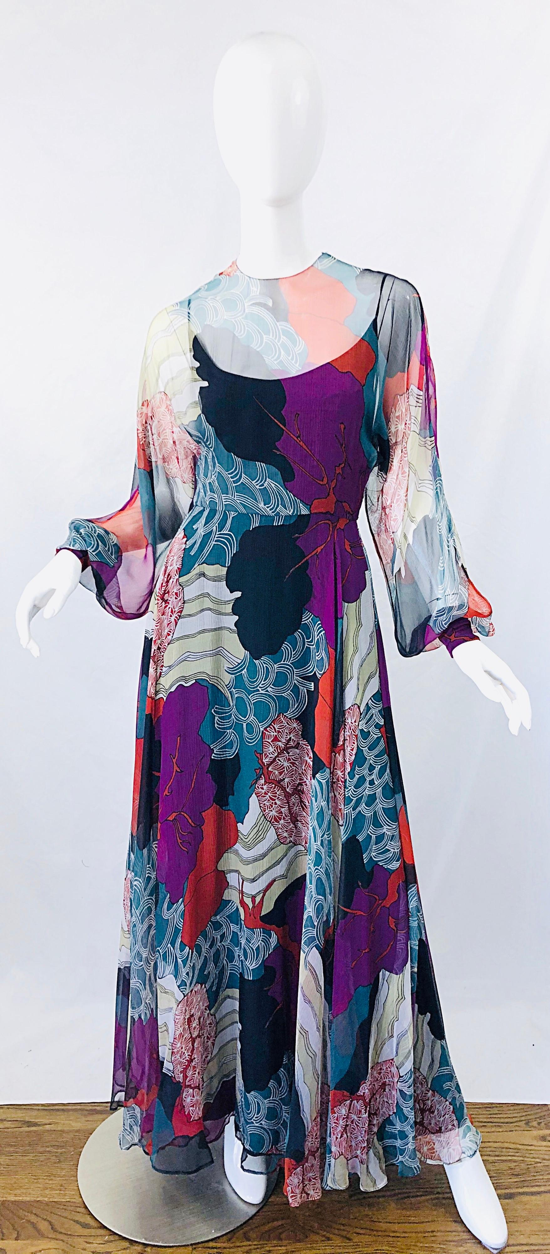 Absolutley stunning rare 1970s vintage CHRISTIAN DIOR by MARC BOHAN hiroshige wave novelty print silk chiffon evening gown maxi dress ! Features a beautiful print in vibrant colors of blue, teal, ivory and pops of orange throughout. Features semi