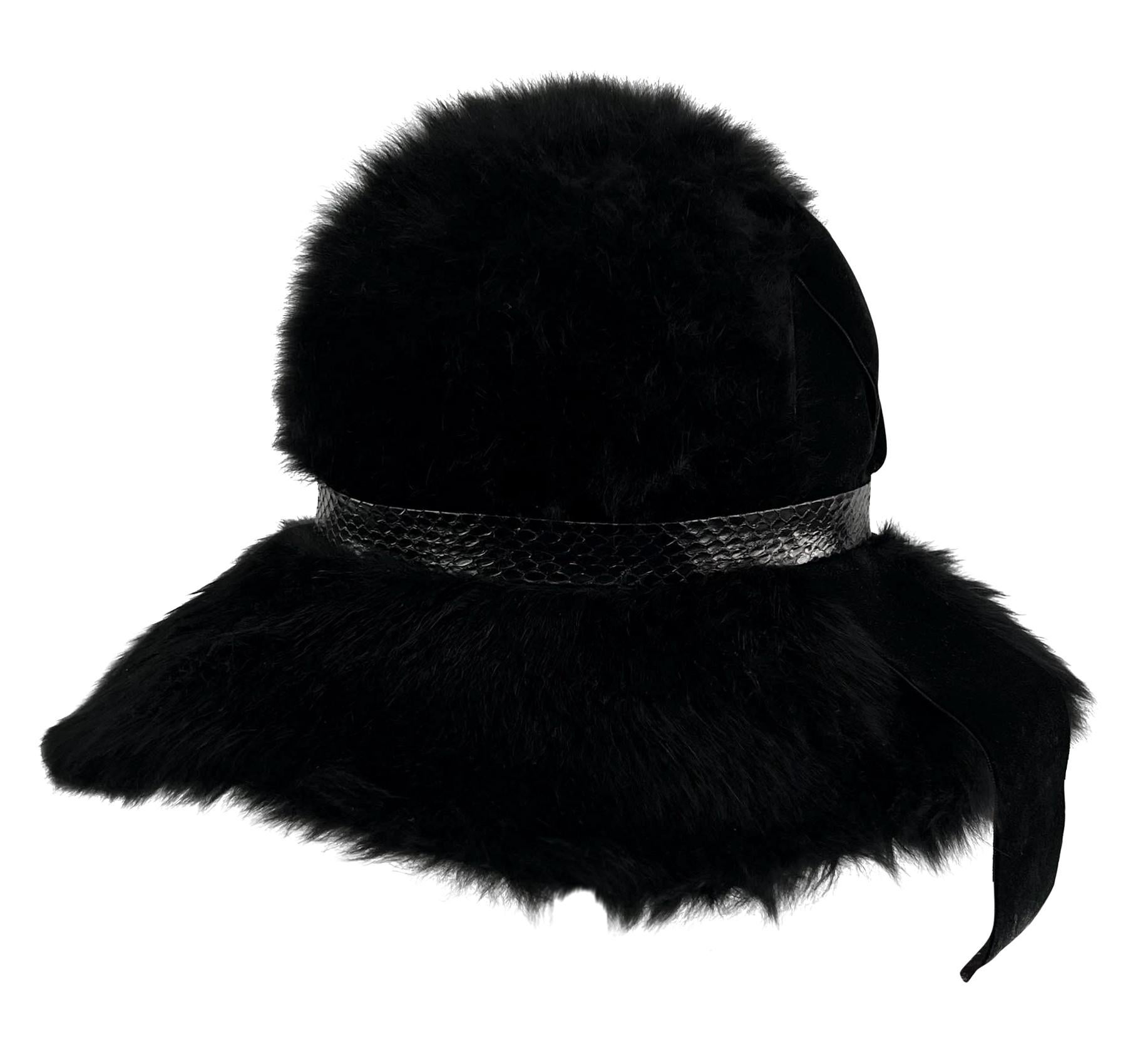 This Christian Dior floppy hat from the 1970s is constructed of faux fur with an embossed leather band and velvet ribbon accents. 

Approximate measurements: 
Size - removed
Top Diameter: 6”
Circumference: 23”
Crown Height: 6”
Brim width: 4”