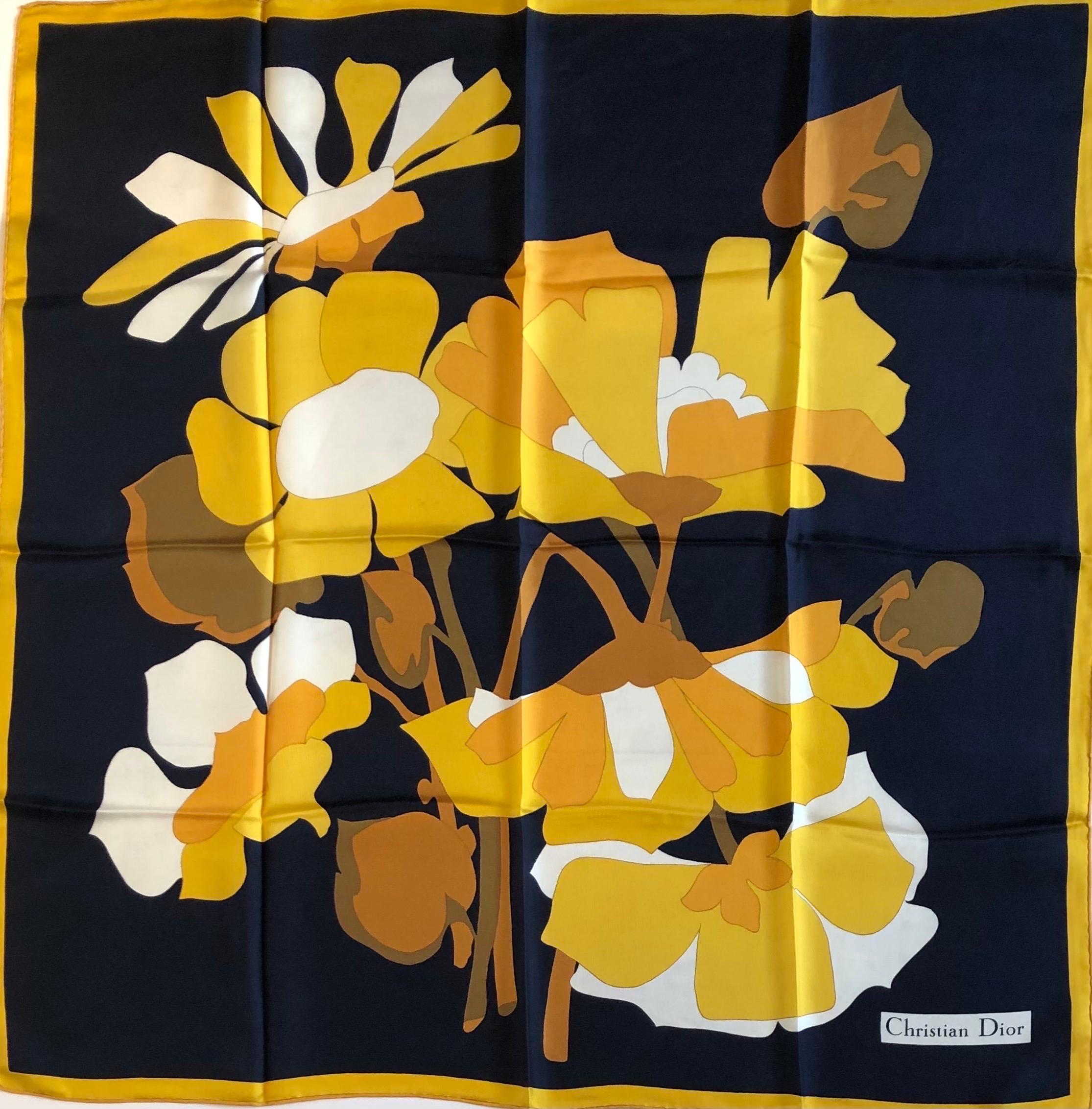 1970 CHRISTIAN DIOR Flower Multi Silk Printed Scarf 
Christian Dior luxurious silk scarf in stunning bright colour tone, navy blue, gold with off-white background and flower bouquet motifs print, 100% silk.  The CD Box in the photos is not for sale