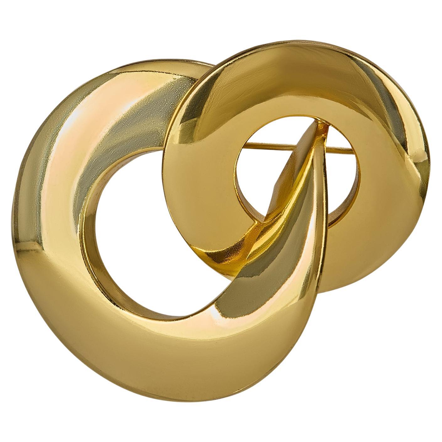 Broche de círculos entrelazados de oro de Christian Dior de los años 70