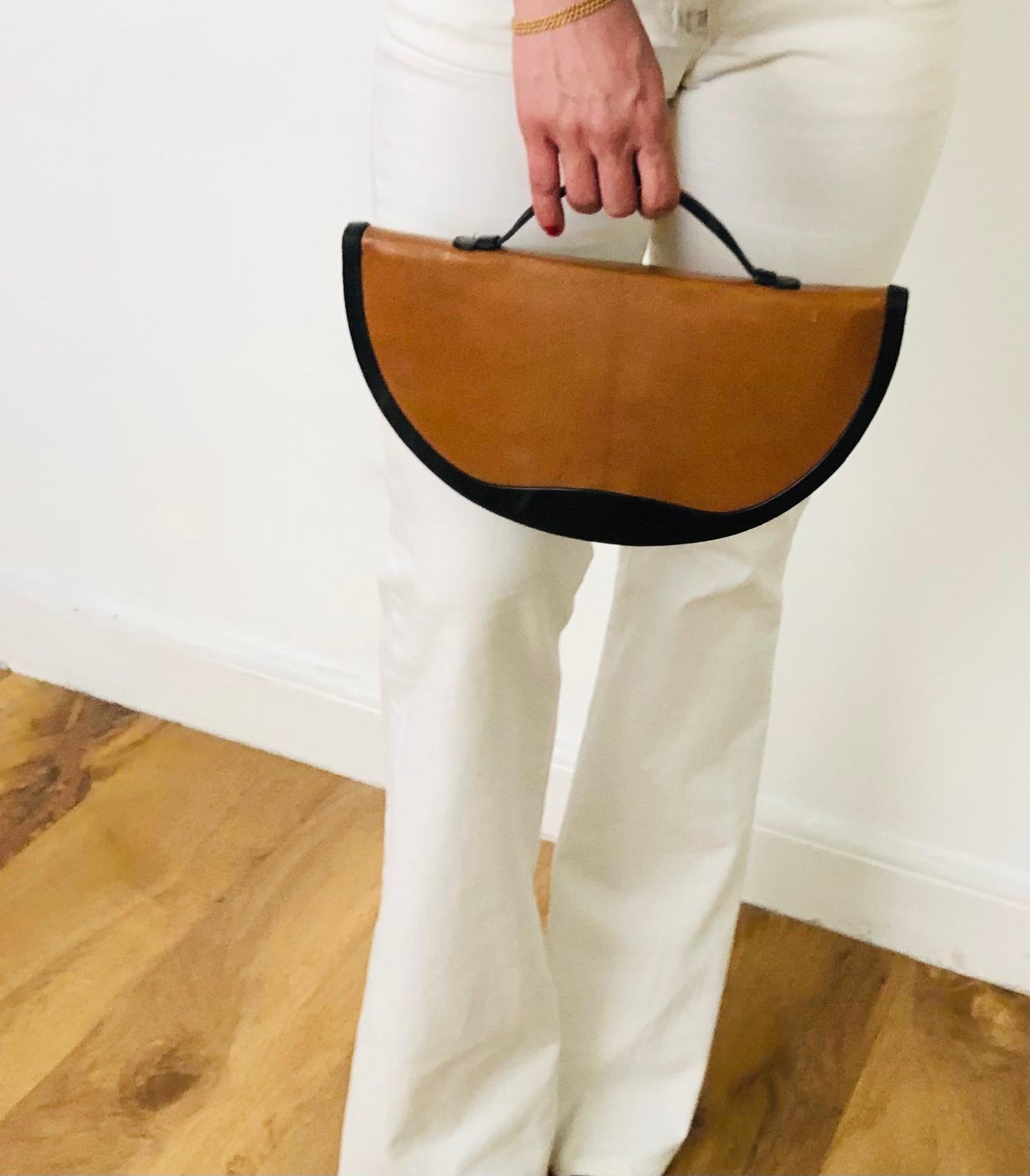FREE UK and WORLDWIDE DELIVERY 

Elegant and rare Christian Dior half moon bag featuring shiny black and brown leather, small top handle, inside pocket. 
Condition: vintage, 1970s, slight signs of wear on the back due to age but overall very good