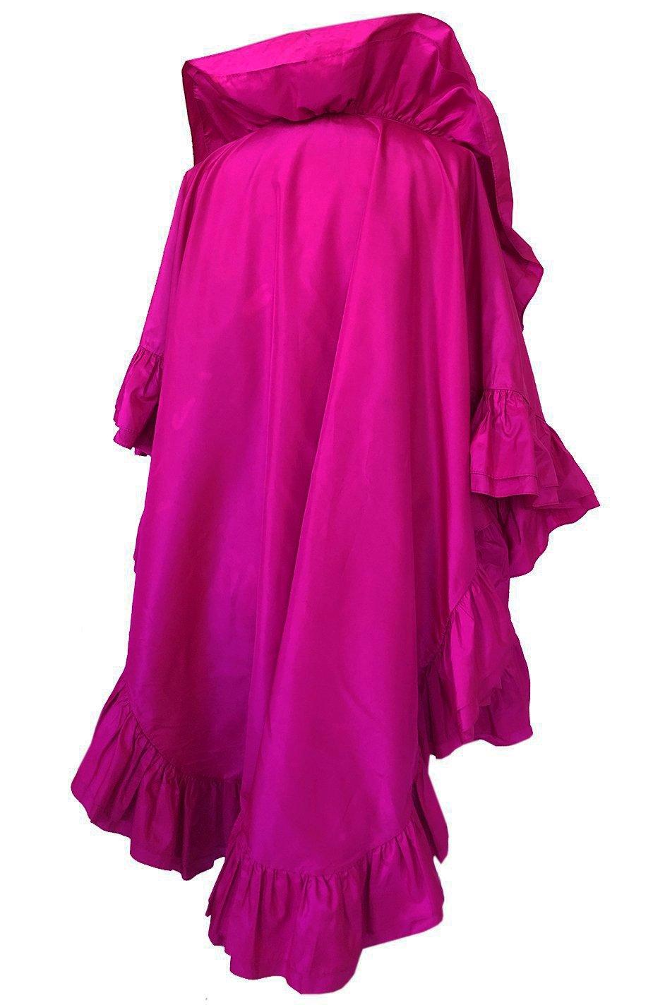 The vivid pink of this silk ruffled Dior evening piece is absolutely exquisite. Even though it a a bright pow of color it will still suit most skin tones and be a dramatic pop of color to any look. It is made from a high end silk taffeta. The design