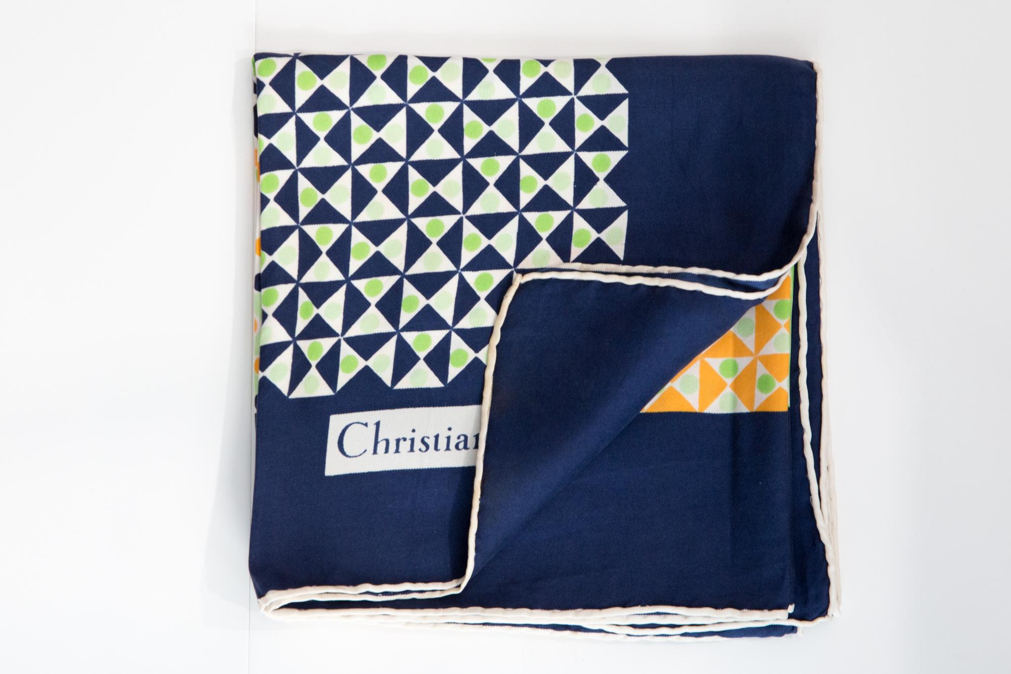 Christian Dior Silk Scarf featuring a navy border, a multico graphic diagonal geometric print, a Christian Dior signature. 
Circa 1970s
In good vintage condition. Made in France.
30.7in (78cm)  X 30.7in (78cm)
We guarantee you will receive this 
