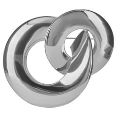 Spilla a cerchi intrecciati in argento di Christian Dior degli anni '70