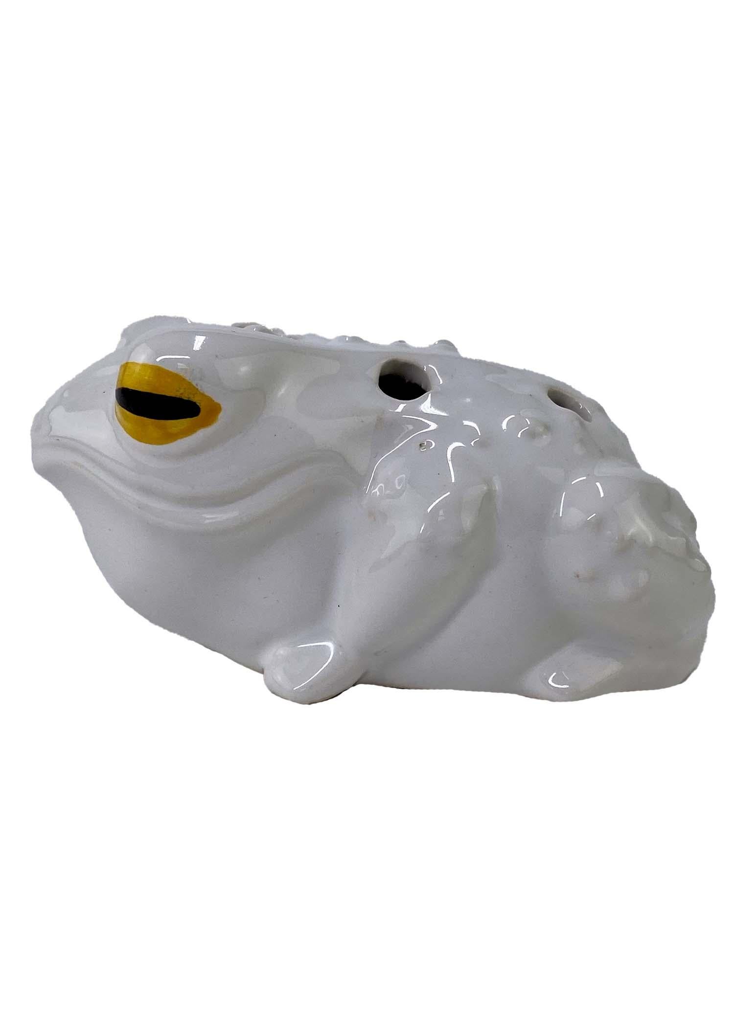TheRealList presents: a white glazed enamel flower frog by Christian Dior. This piece is a whimsical take on the traditional flower frog form that is sure to be a conversation starter. Though this piece stands out on its own, it can also be used to