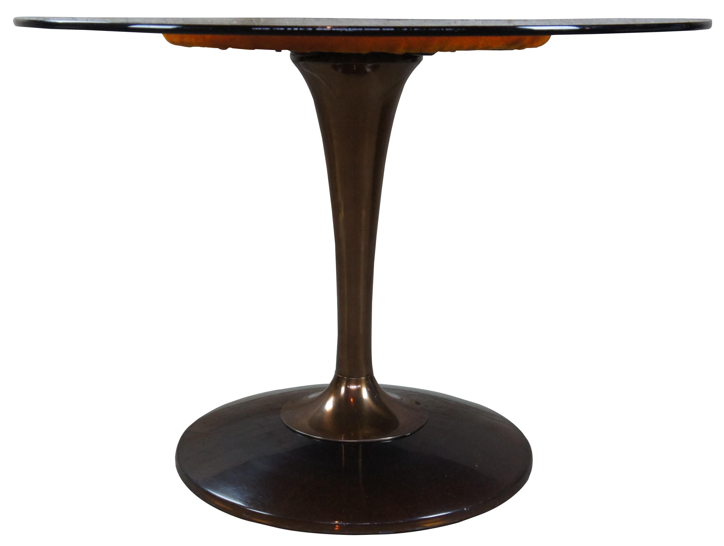 Chromcraft Saarinen smoked Lucite and glass dining table. Features an amber colored glass top, circa 1970s.