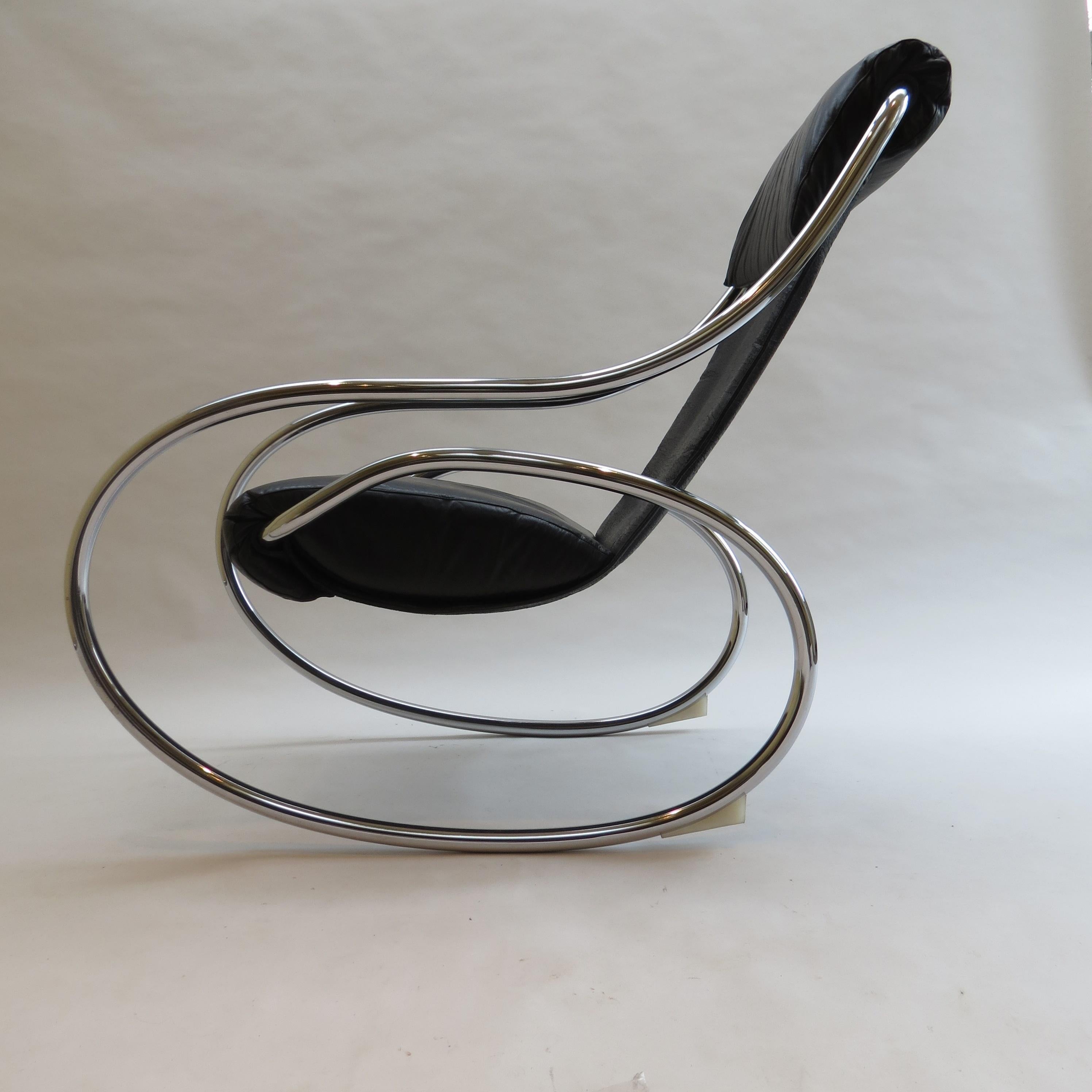 1970s rocking chair with a sculptural chrome tube frame and leather slung seat.  It was originally retailed through Heals, London.

The chair is good vintage condition, there is some distressing to the leather through normal wear and tear.  The