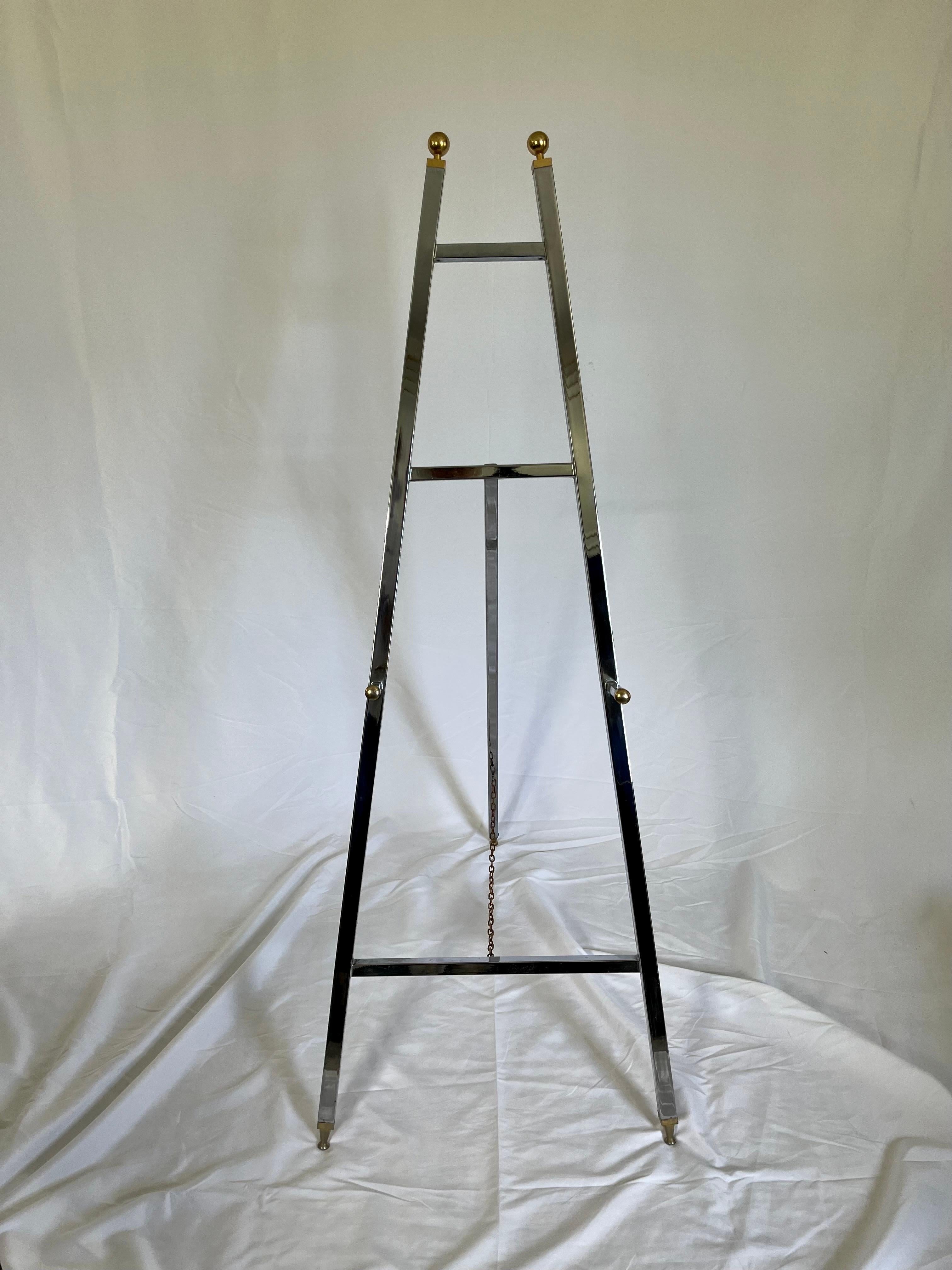 Italian 1970s chrome and brass easel, with chrome chain. Measures 2