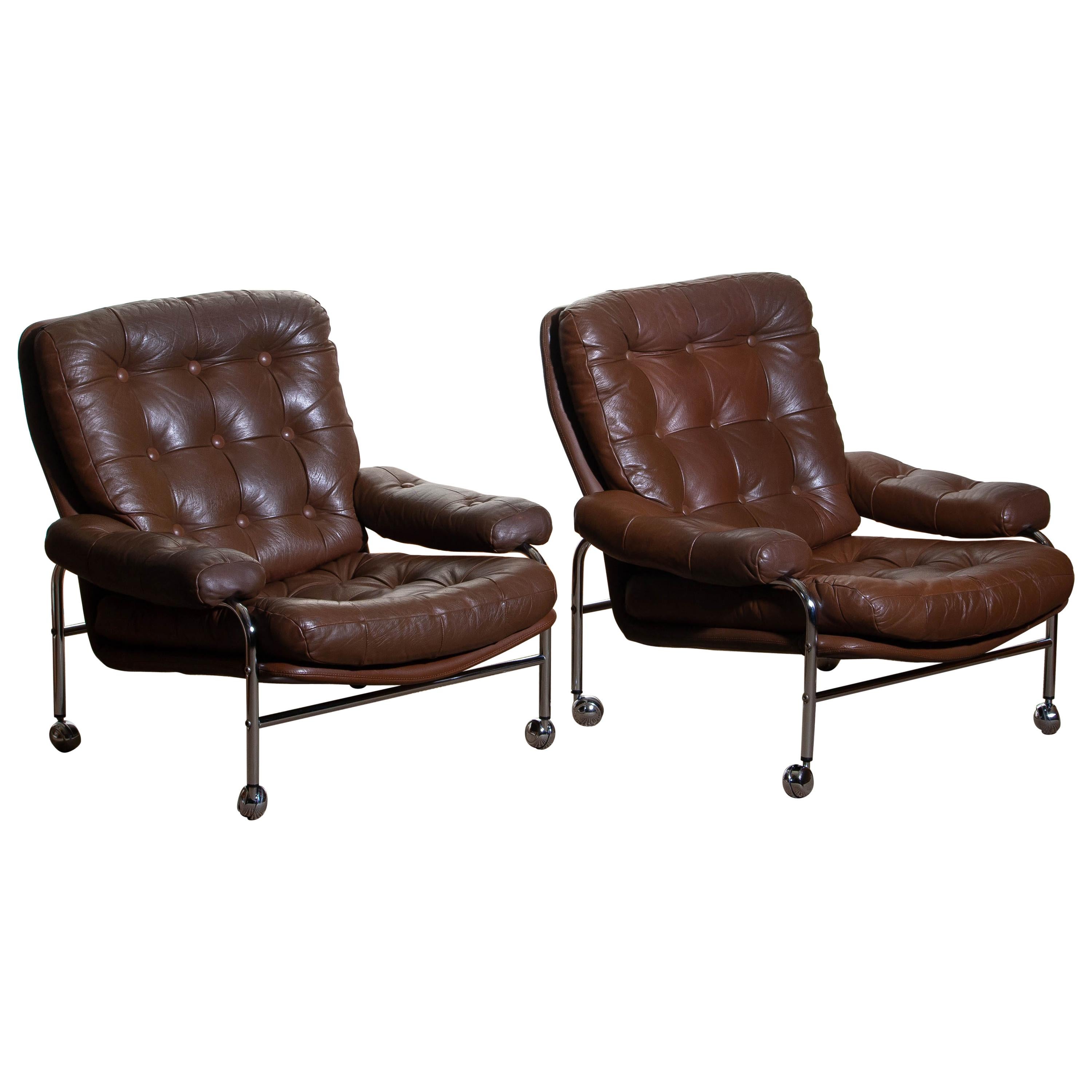 Beautiful set of two extremely comfortable easy or lounge chairs made by Scapa Rydaholm, Sweden.
These, typical Scandinavian chairs are upholstered with brown leather-based on a chromed metal frame.
All in perfect condition.

Period: 1970.
  