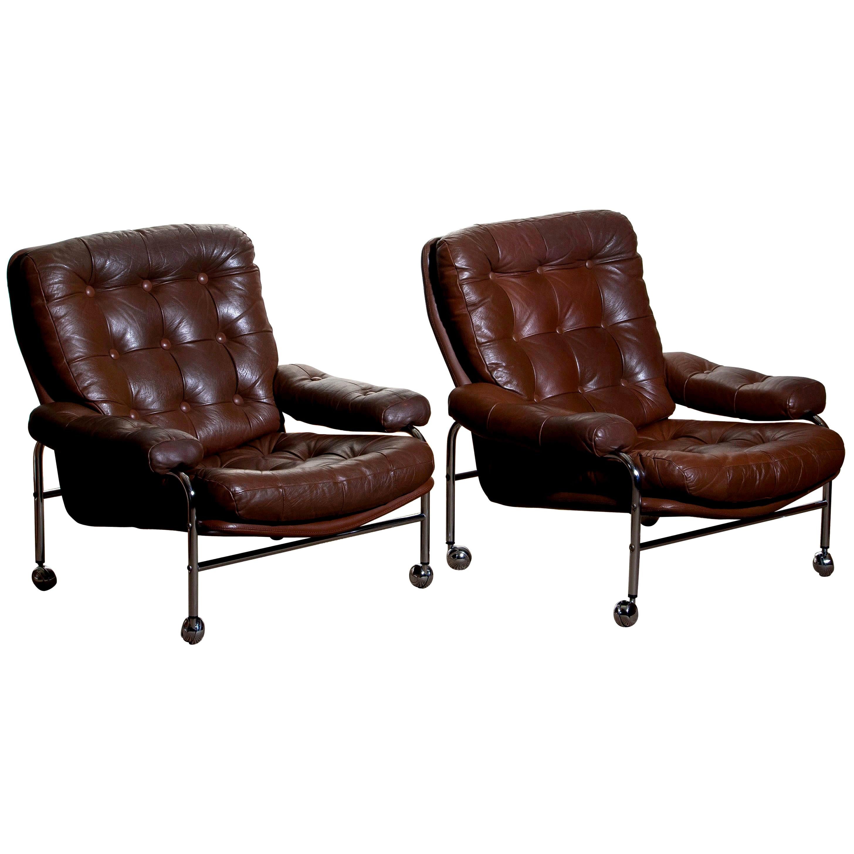 Beautiful set of two extremely comfortable easy or lounge chairs made by Scapa Rydaholm, Sweden.
These, typical Scandinavian chairs are upholstered with brown leather-based on a chromed metal frame.
All in perfect condition.

Period: 1970.
 