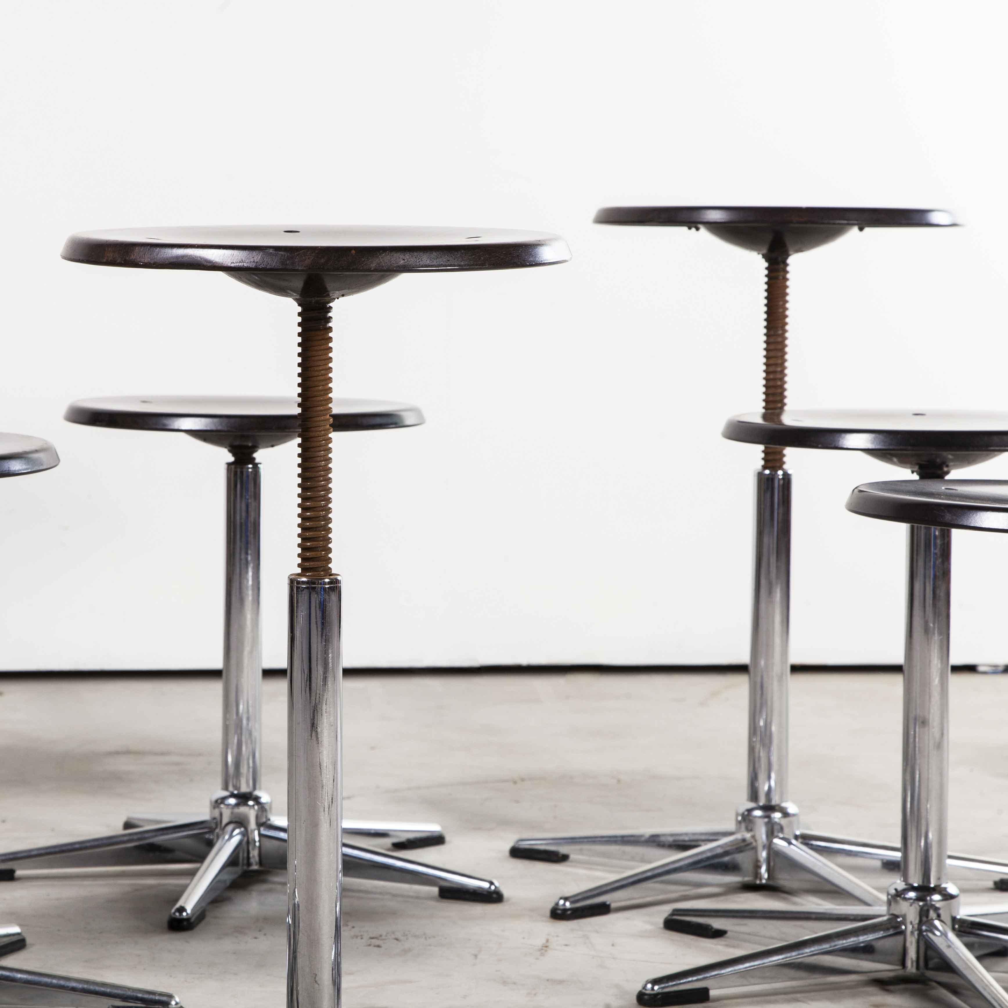 1970s chrome and dark walnut stools by Pagholz - Set of eight

1970s chrome and dark walnut stools by Pagholz - Set of four. Simple chrome stools that swivel and are thus height adjustable with a central threaded bar. The seats are made from