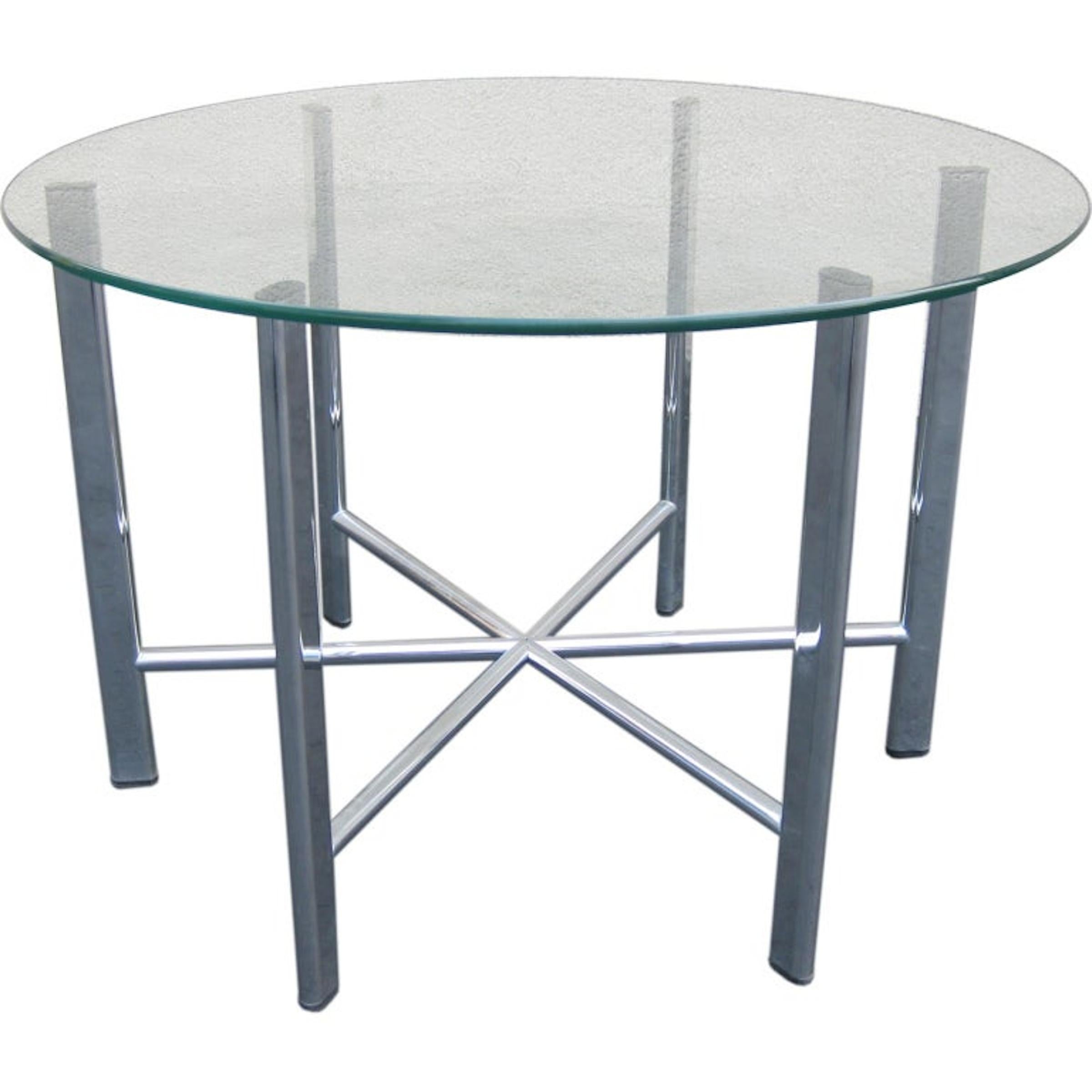 Mid-Century table chrome base with round glass top. Six legs with star base.