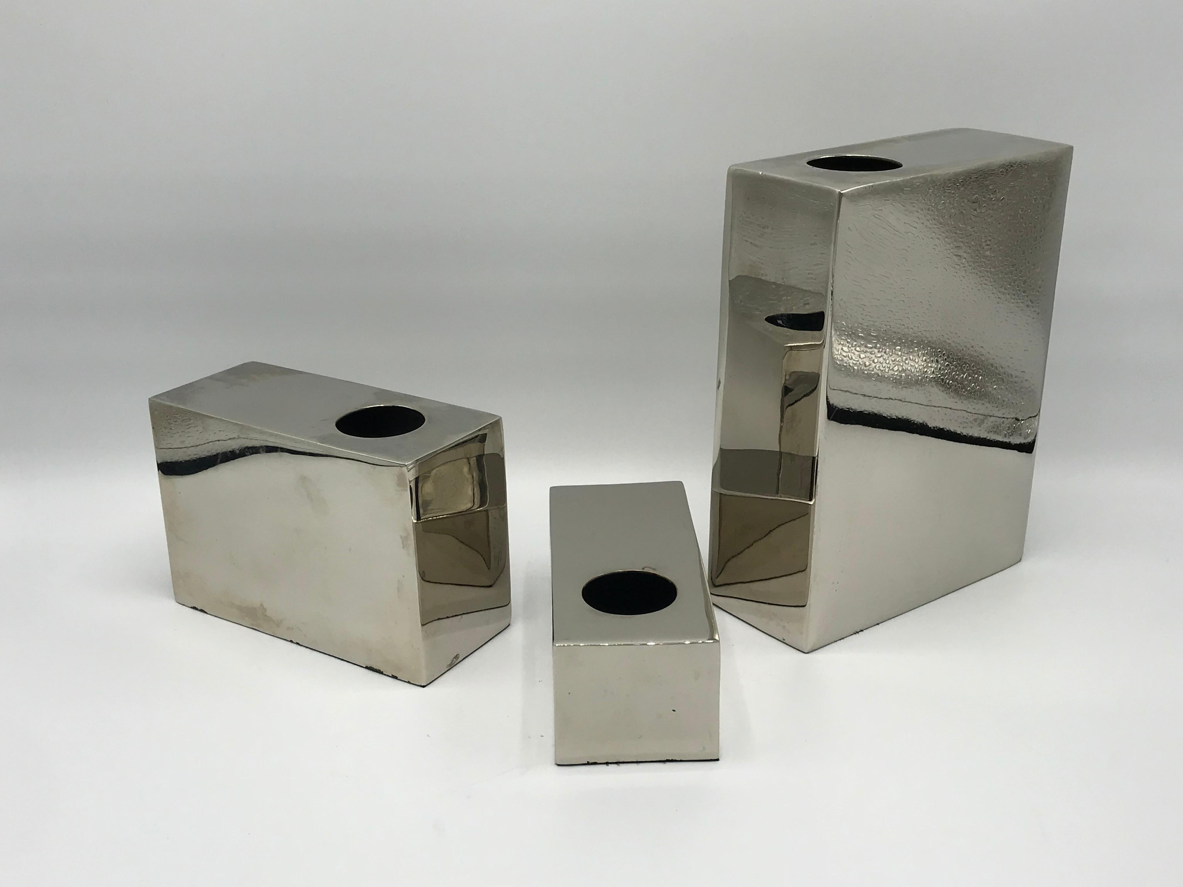 Listed is a gorgeous, set of three, 1970s Milo Baughman style chrome cube vases. Heavy, weighing nearly 5lbs for the set. 

Measures: Large 8in H
Medium 4in H
Small 2in H.