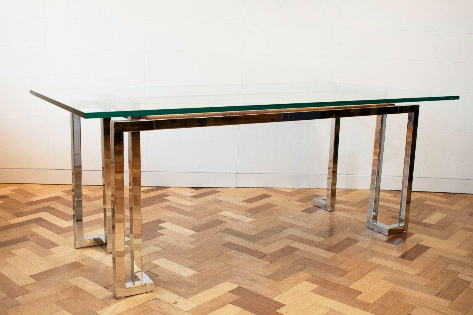 A very elegant 1970s glass desk by Pieff Lisse from the Mandarin Collection.

This desk comprises of chrome legs and framing, a glass top, all completed by a rattan shelving. 

This is a beautifully elegant piece that compliments any