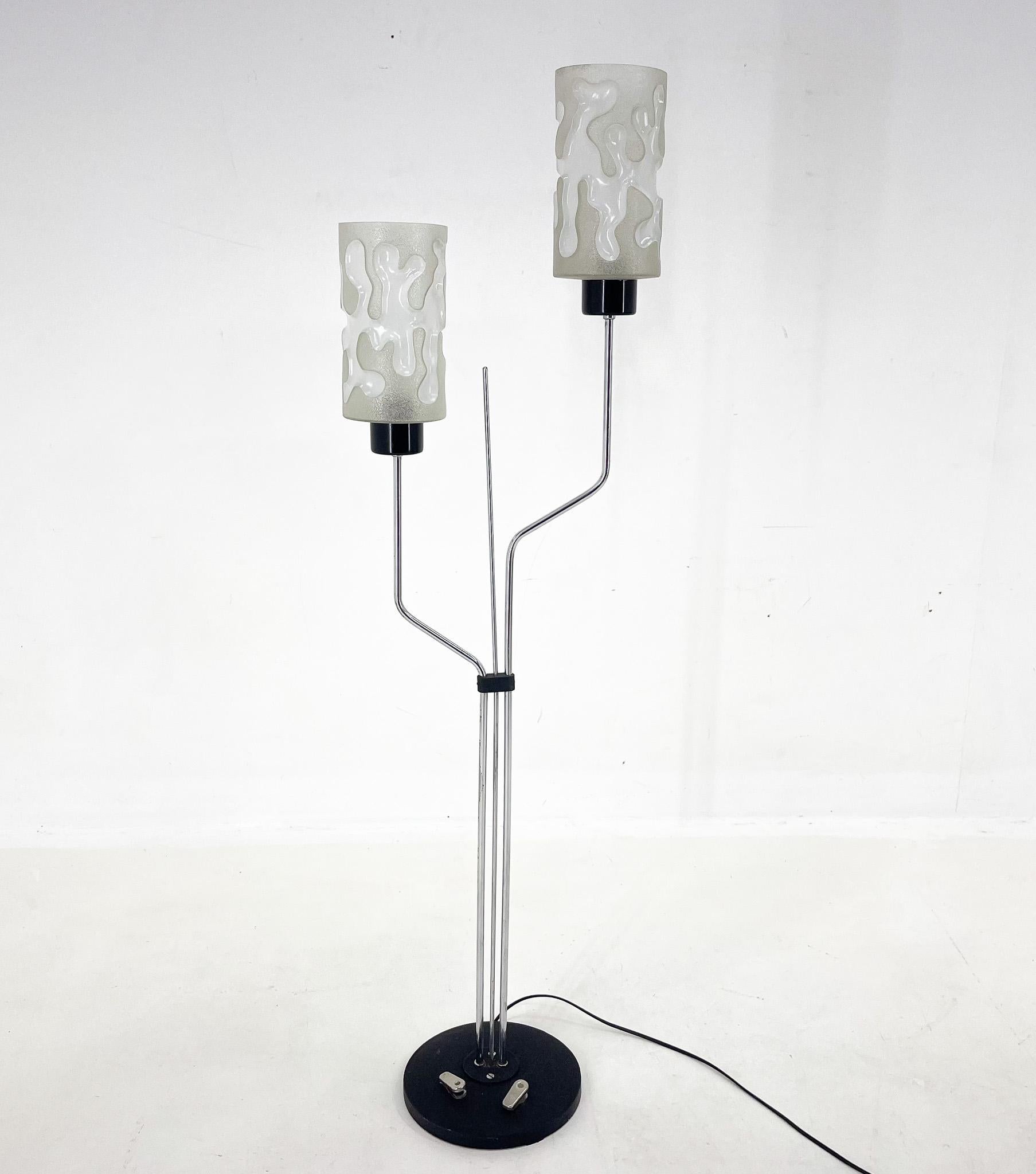 Vintage floor lamp made of chrome, metal and glass. Produced by the famous Lidokov company in former Czechoslovakiain the 1970's. The lamp has two original step-on switches that light the lights separetely. The diameter of the lamp shade is