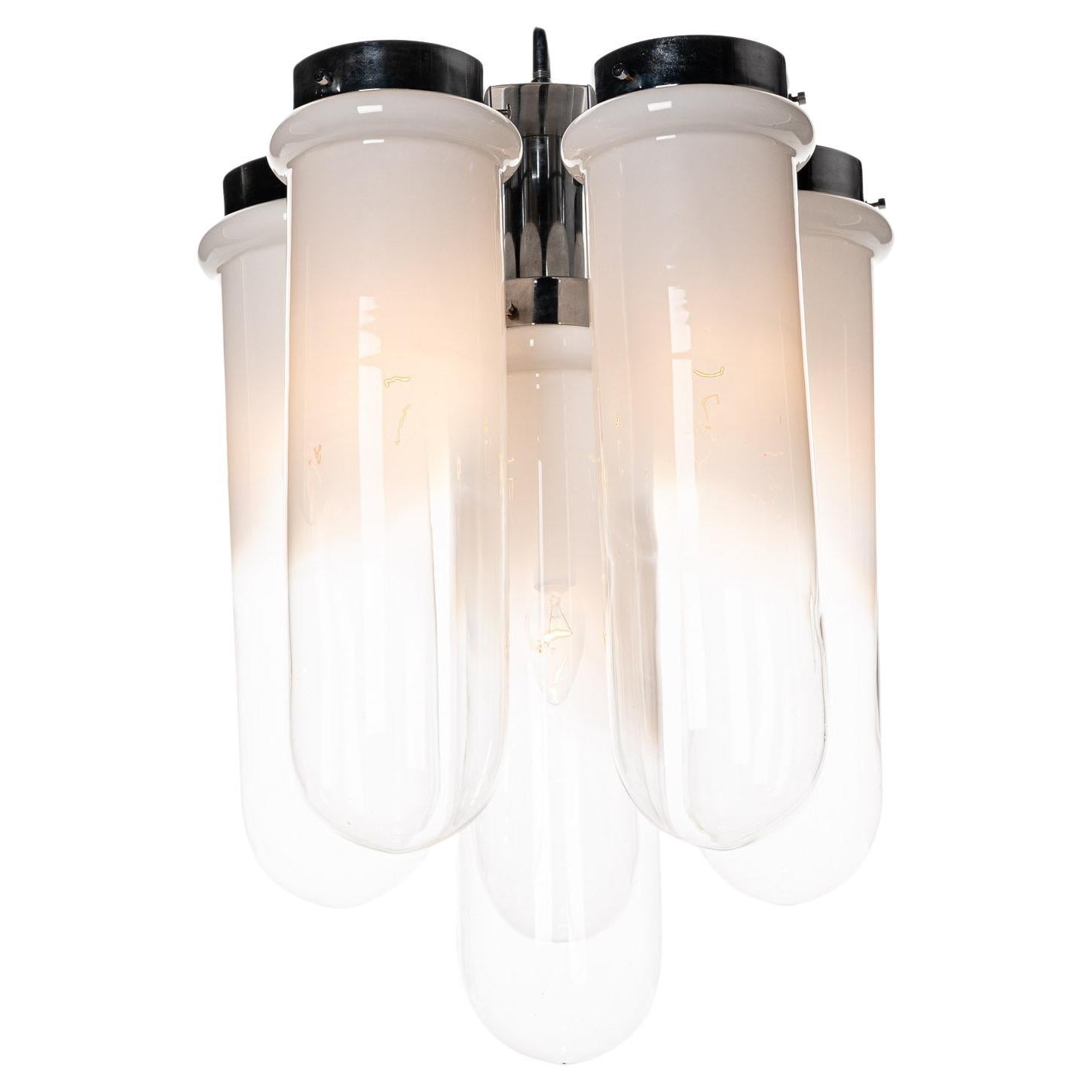 Six stunning smokey glass to clear glass tubes hanging from a chrome base. Six E14 lightbulbs. We have five matching wall lights in stock with on each one a similar glass tube.