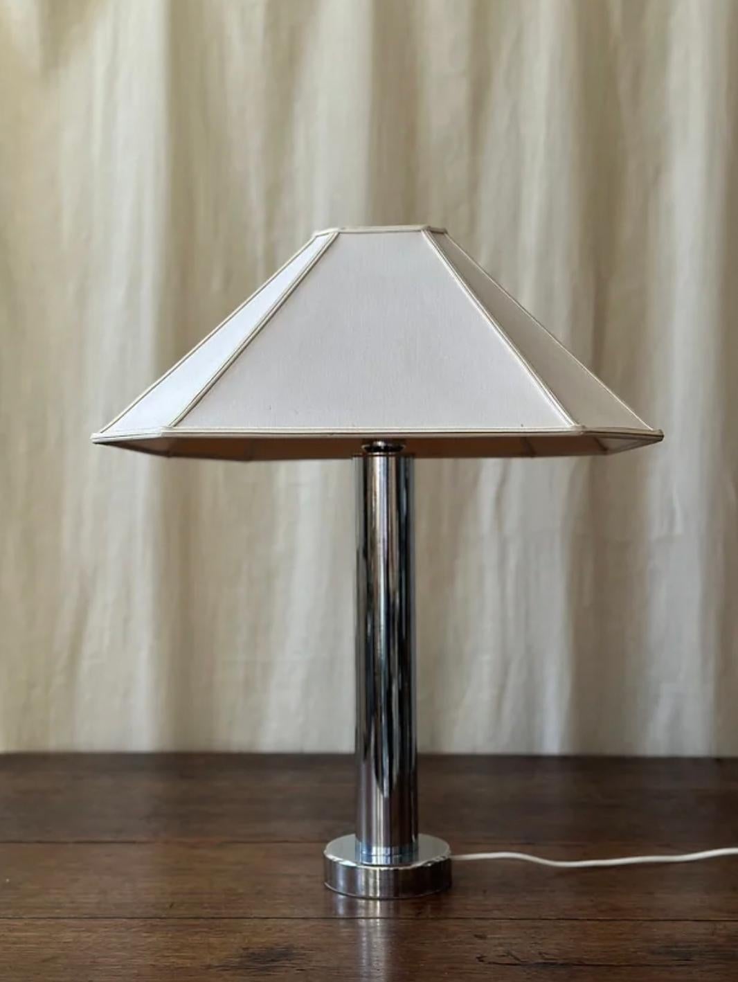 1970s Chrome Lamp & Shade, Lamp by Kosta Elarmatur, Sweden.

Lamp Rewired for GB & PAT Tested 

Lamp Measures (Not Including Shade) - 46 cm (Height) x 12cm (Depth)

Shade Measures -  47cm in (Diameter/ Width), 20cm (Height)

Condition - The lamp has