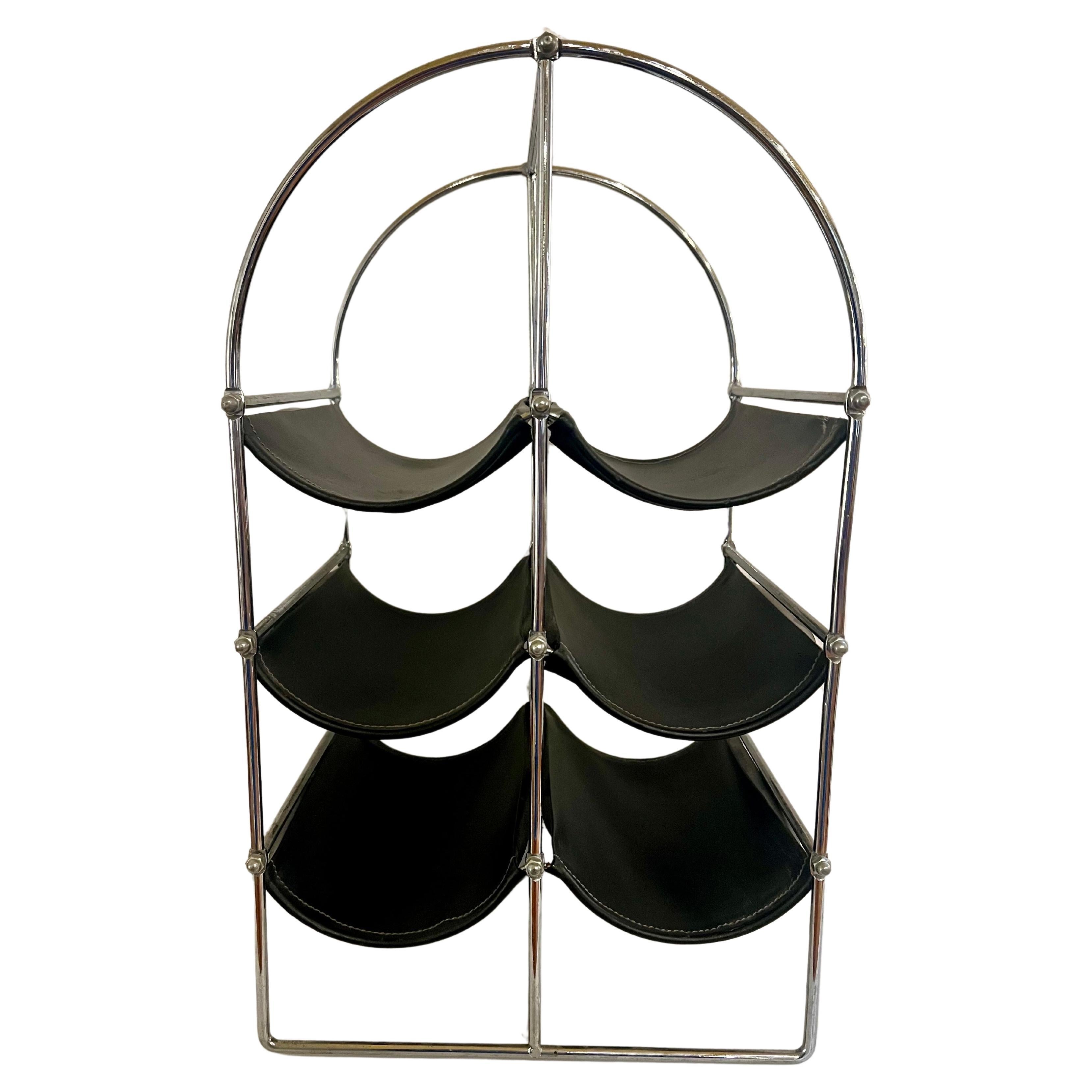 a practical minimalist chrome plated metal with Naugahyde beds for resting wine bottles, circa 1970's nice condition.