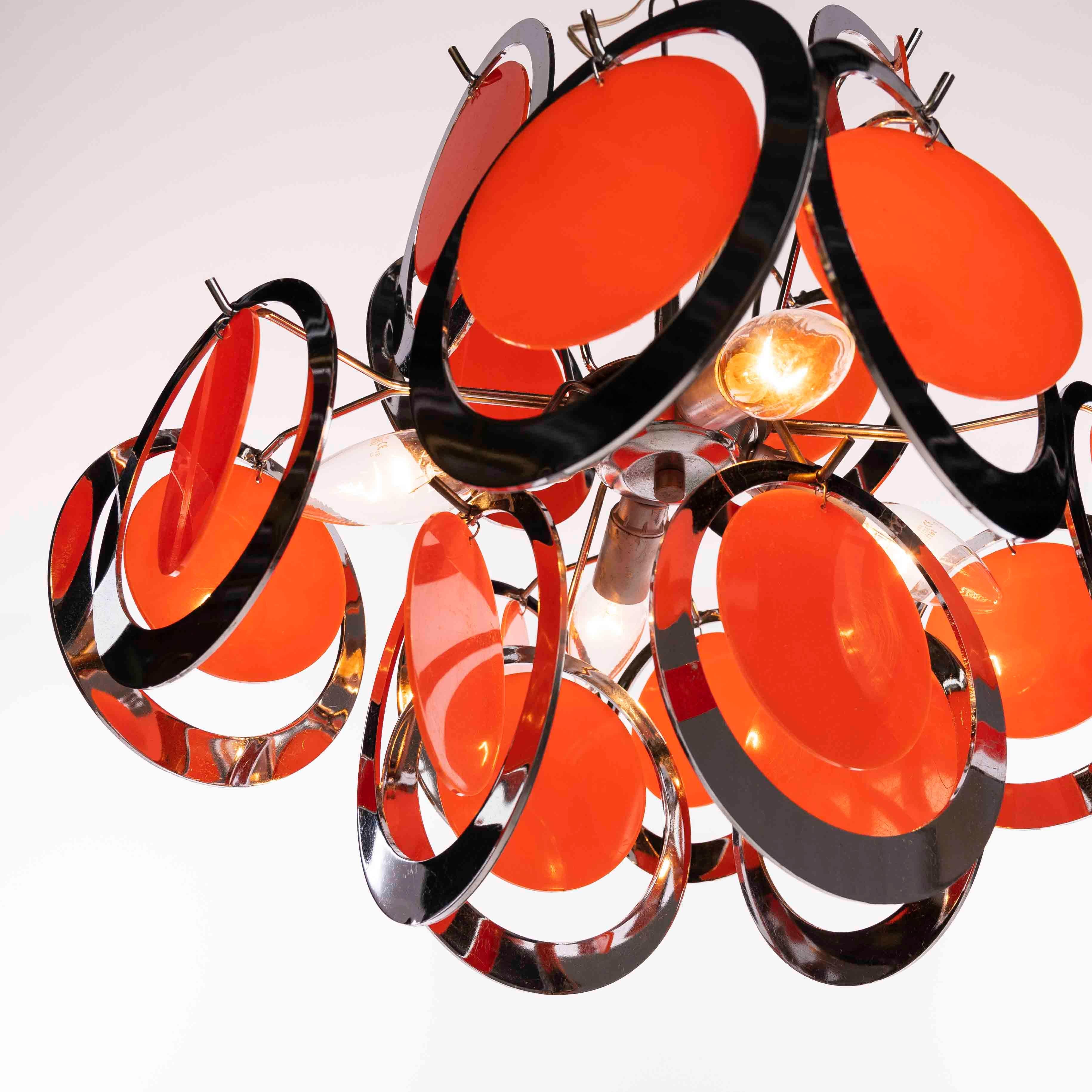 1970s Chromed Plastic Rings with Orange Plastic Circles In Fair Condition For Sale In Schoorl, NL