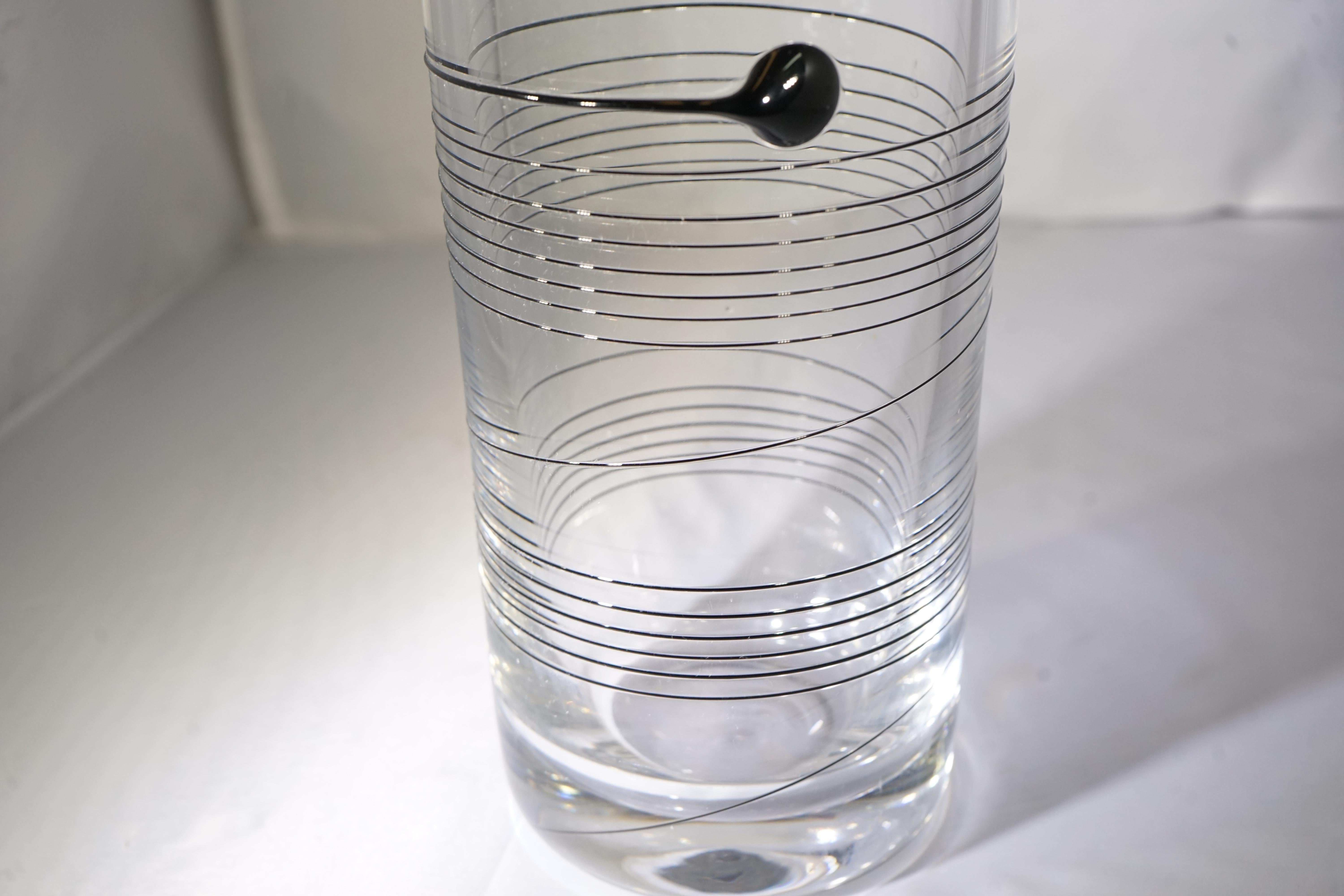 1970s tall clear glass vase with black swirl design.