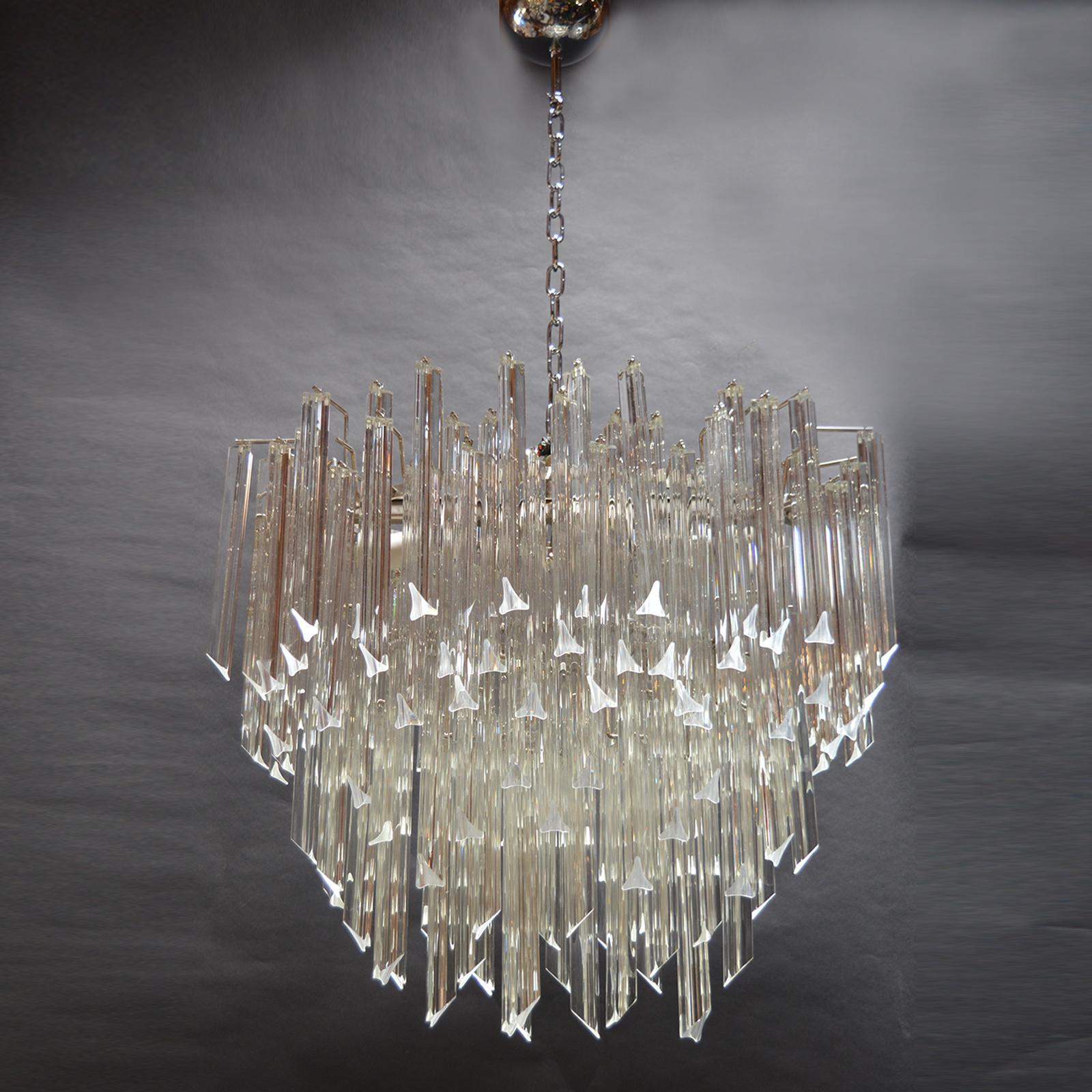 Clear Tiered Glass Chandelier. Italy, 1970s 

Stamped with sticker.
Height up to canopy is 52 inches as specified on the measurements, however, without the chain and canopy the chandelier has a height of 27 inches.