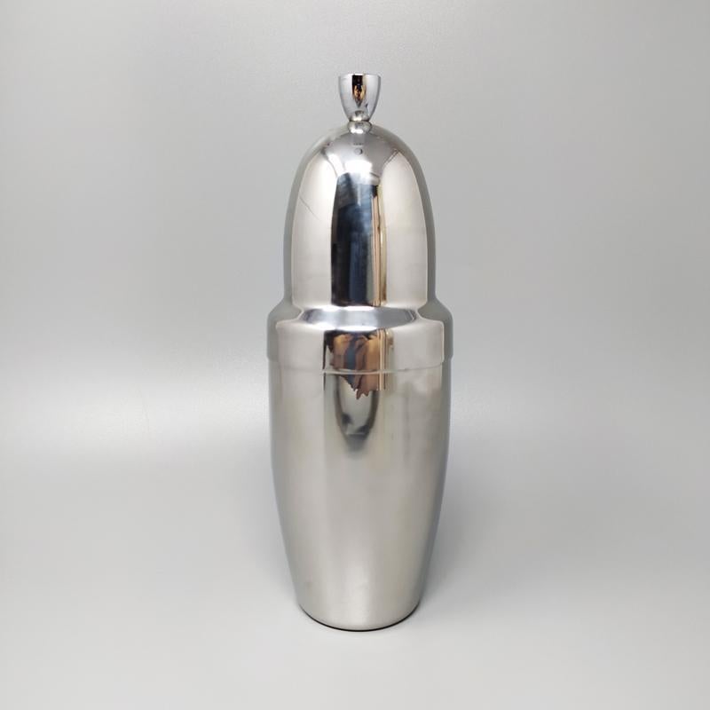 1970s Astonishing Cocktail Shaker WMF Cromargan by Jo Laubner in stainless steel. Made in Germany. This shaker is in excellent condition.
Dimensions: diam 3,54 x 10,23 H inches
Dimensions: diam cm 9 x cm 26 H