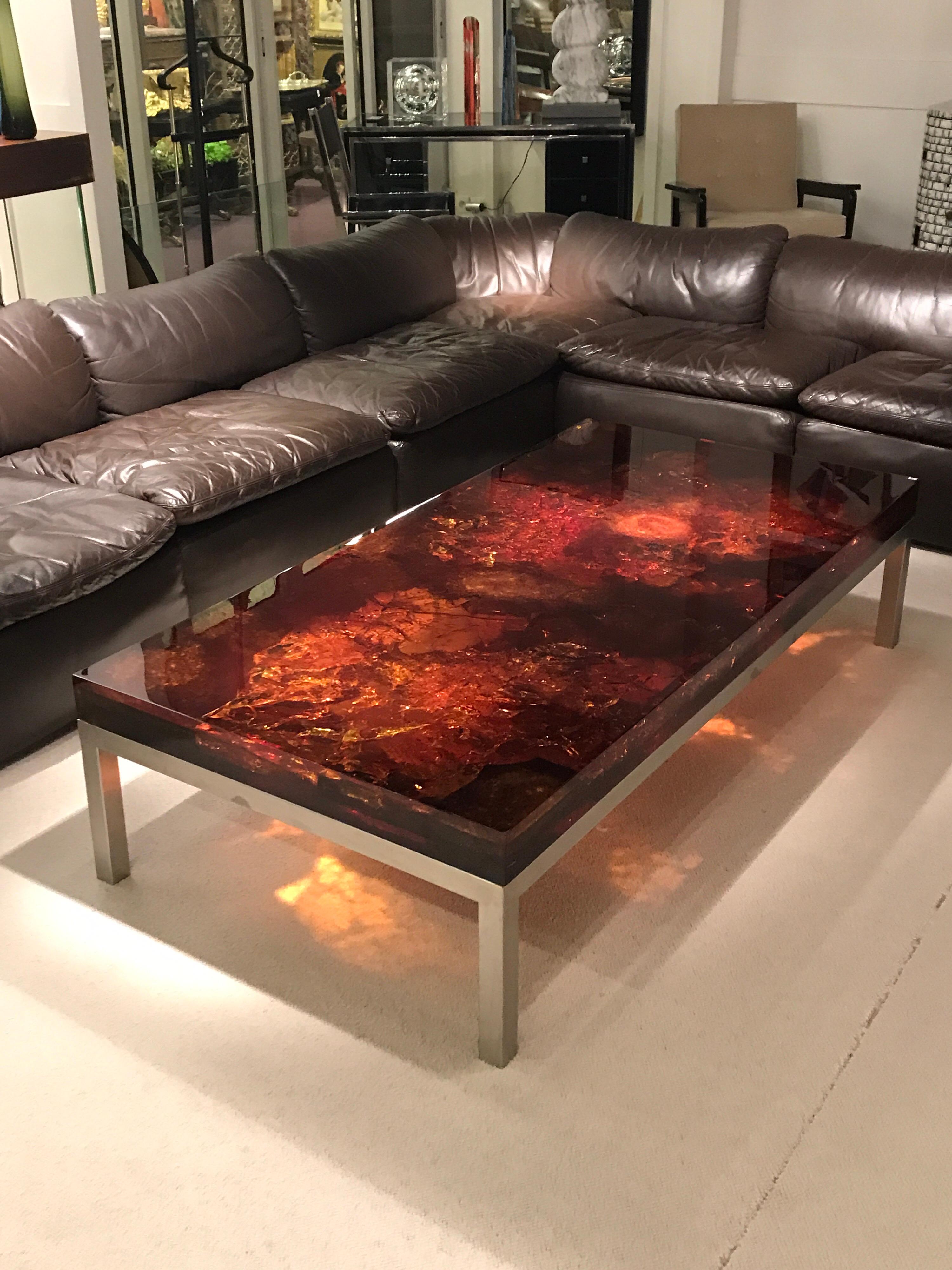 1970s resin fractal coffee table by Marie-Claude de Fouquieres.
Table feet is in stainless steel
Resin looks like amber.
Good vintage condition

Fouquieres Marie-Claude
A wife of a major plastic manufacturer, Marie-Claude de Fouquieres made