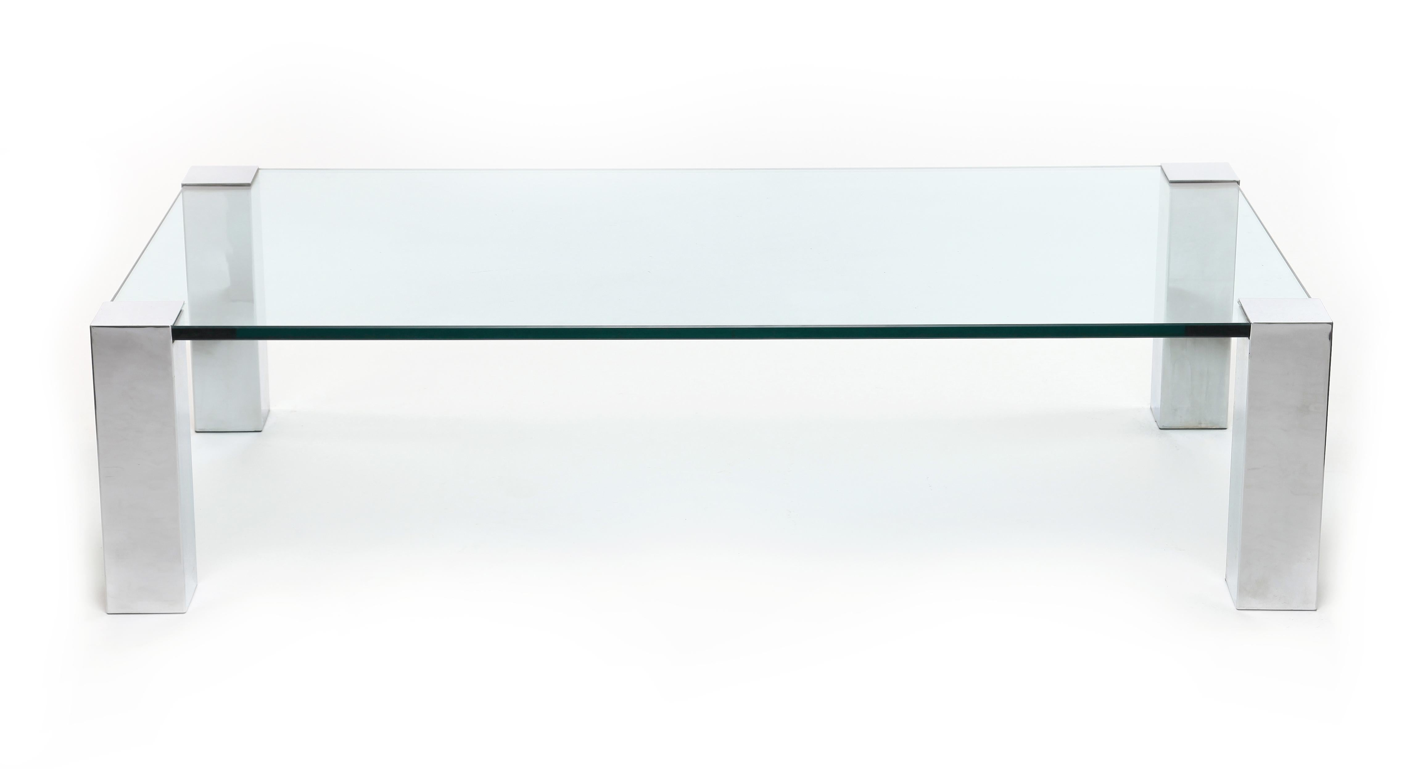 1970s coffee table in glass and chrome attributed to Willy Rizzo for Cidue Italy.

Willy Rizzo's furniture design channelled the sophistication of Mies van der Rohe and Le Corbusier, his pieces combining clean, simple lines with bold geometric