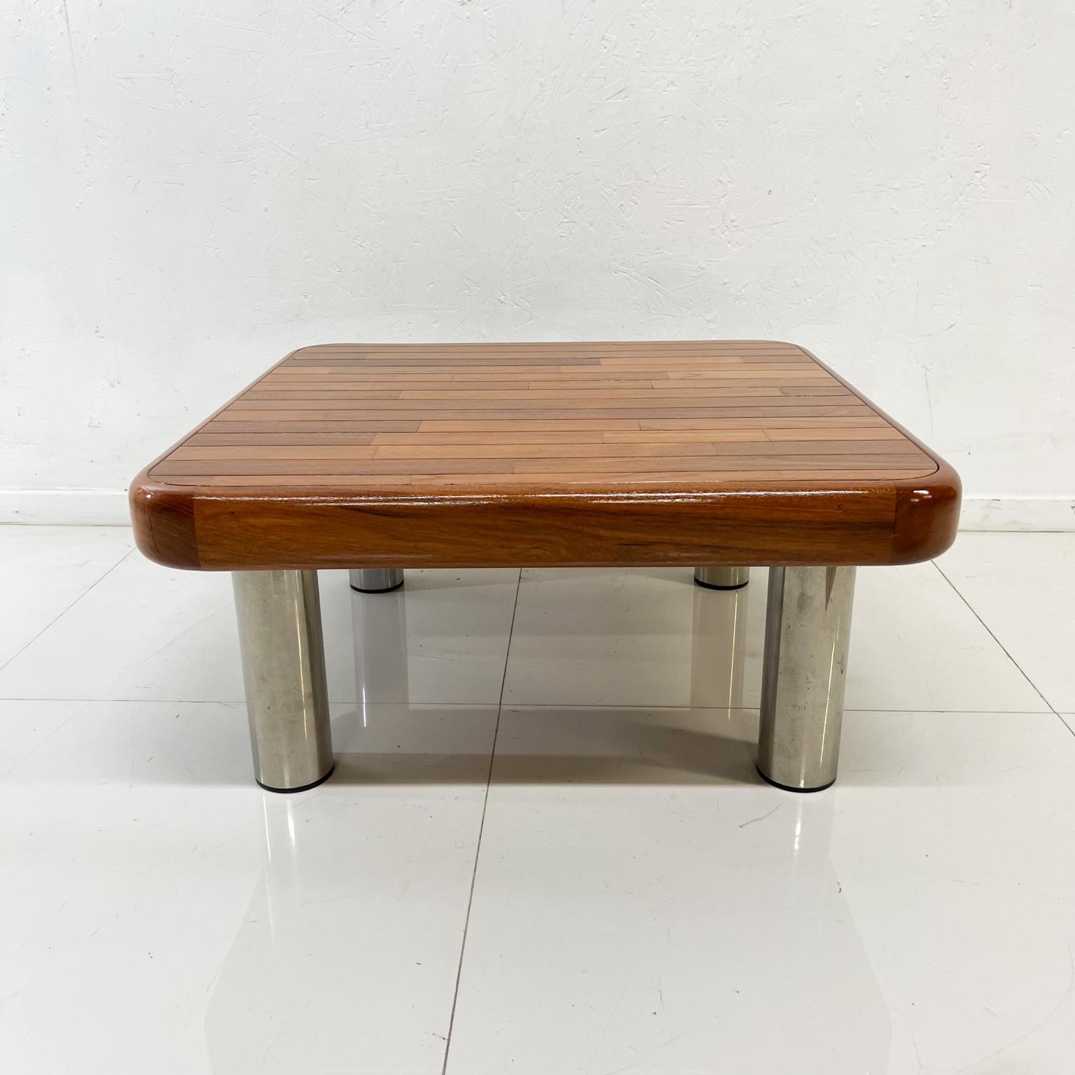 1970s Coffee Table Staved Wood Tubular Chrome Legs
Unmarked.
Modern square low table having an expressive Wood grained top with fat tubular Chromed legs.
13 tall x 28 x 28
Original vintage condition.
Refer to images provided.
      