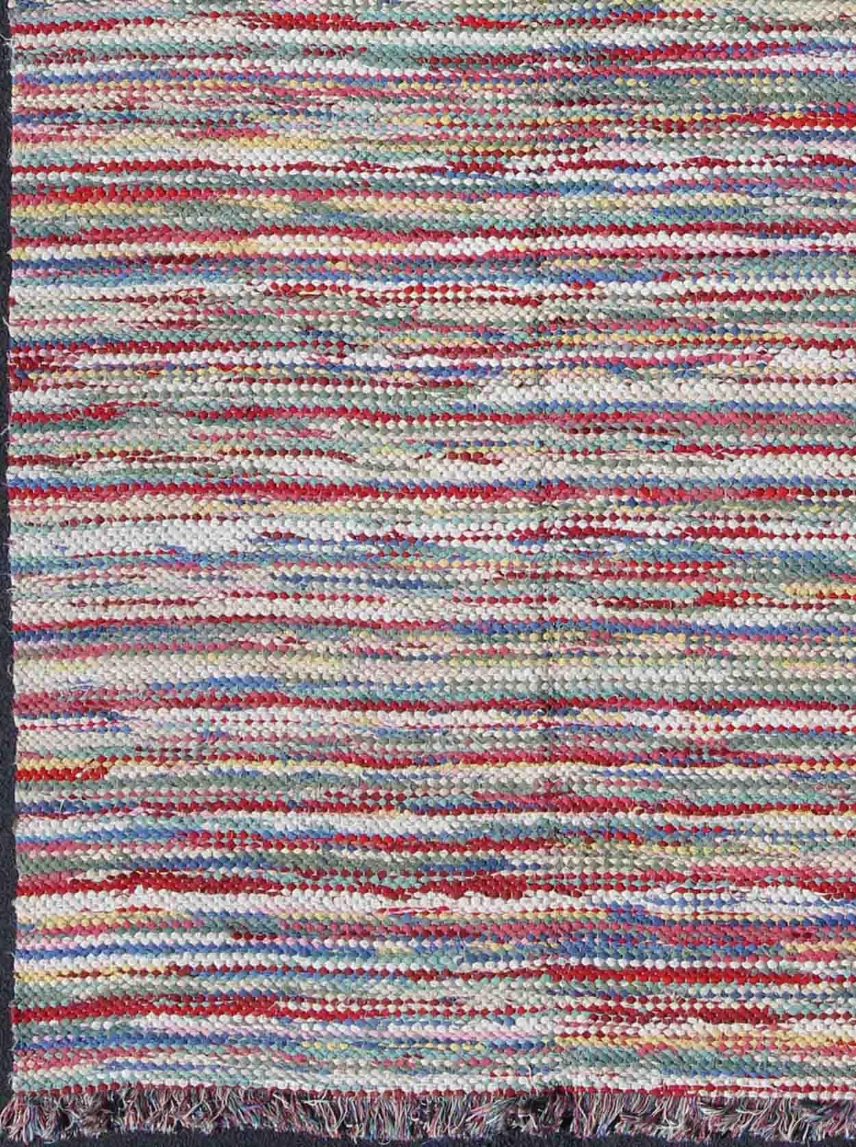 1970s colorful braided rug American with horizontal stripes and fringe detail, rug s12-0809, country of origin / type: America / braided, circa 1960

This large vintage American braided rug (circa 1960) features a vibrant color palette coupled