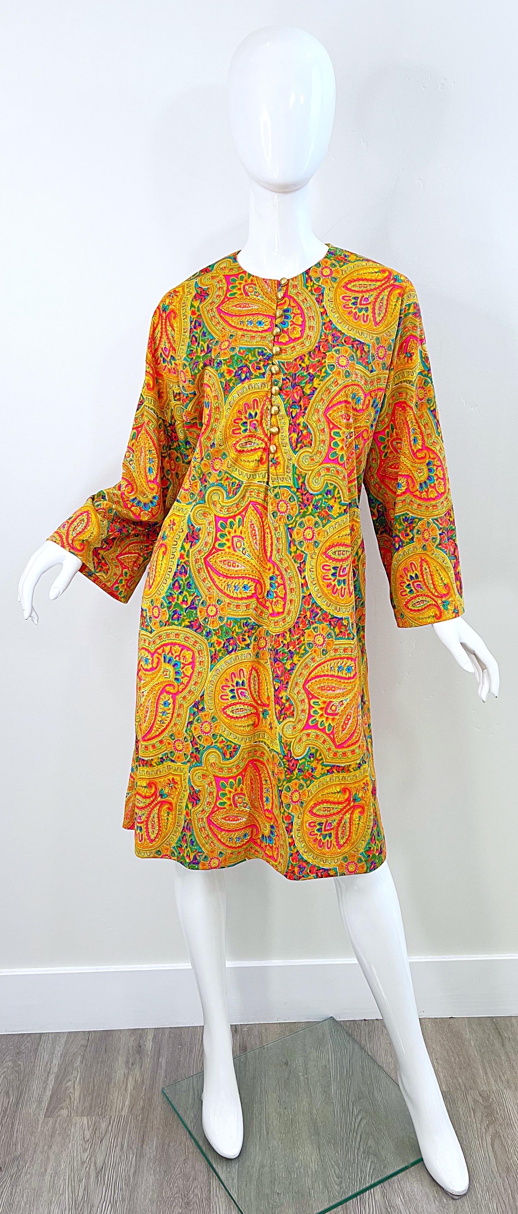 Incredible vintage 70s colorful nylon paisley print long sleeve tunic dress and wide leg trousers ! Tunic simply slips over the head, and features gold etched buttons up the front.Pockets at each side of the hips. Pants have elastic waistband that