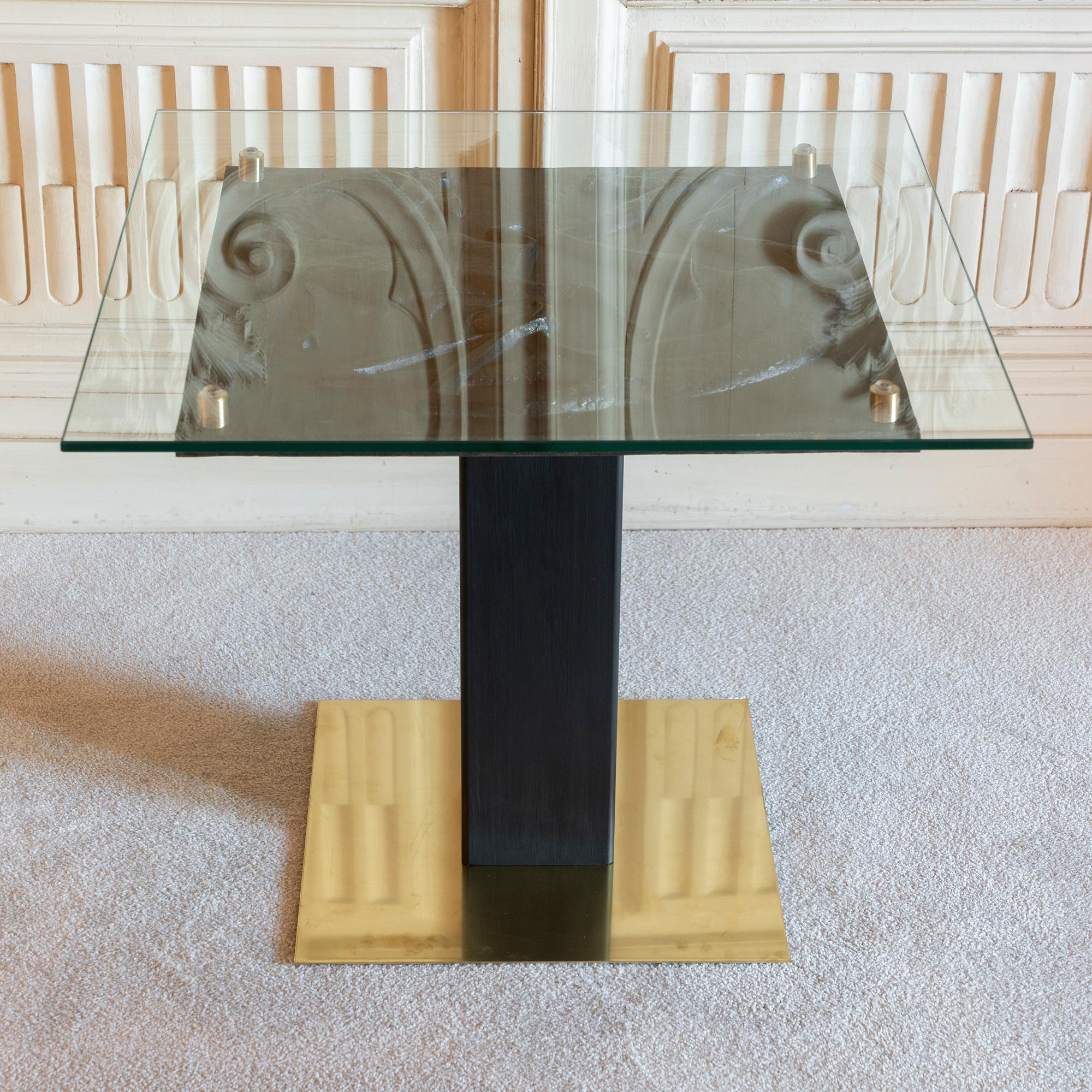 Square side table realized with a figurative black terracotta low relief signed 