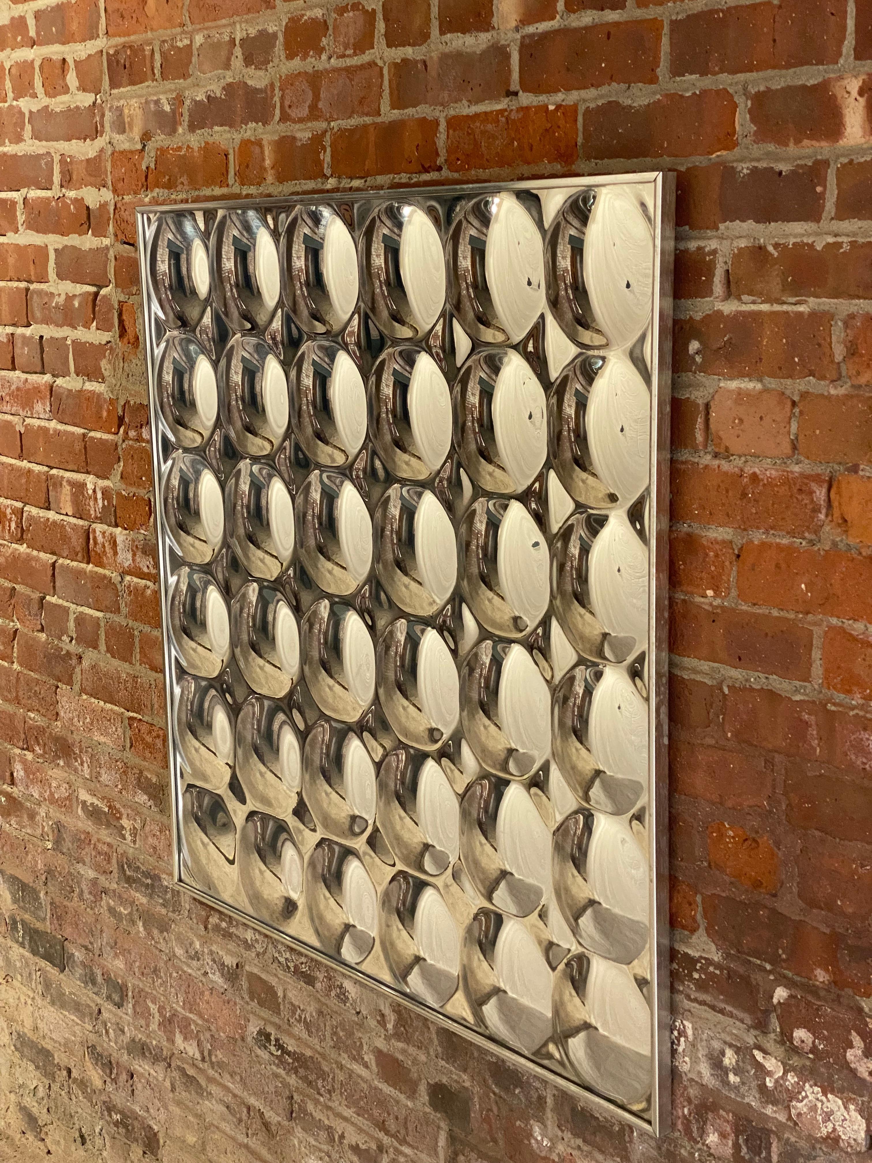 Amazing 1970s convex panel infinity mirror. Large and impressive molded reflective plastic wall mounted mirror. Creates elongated optical effects. Good overall condition with some very minor scuffs to the surface which are not easy to detect. Framed
