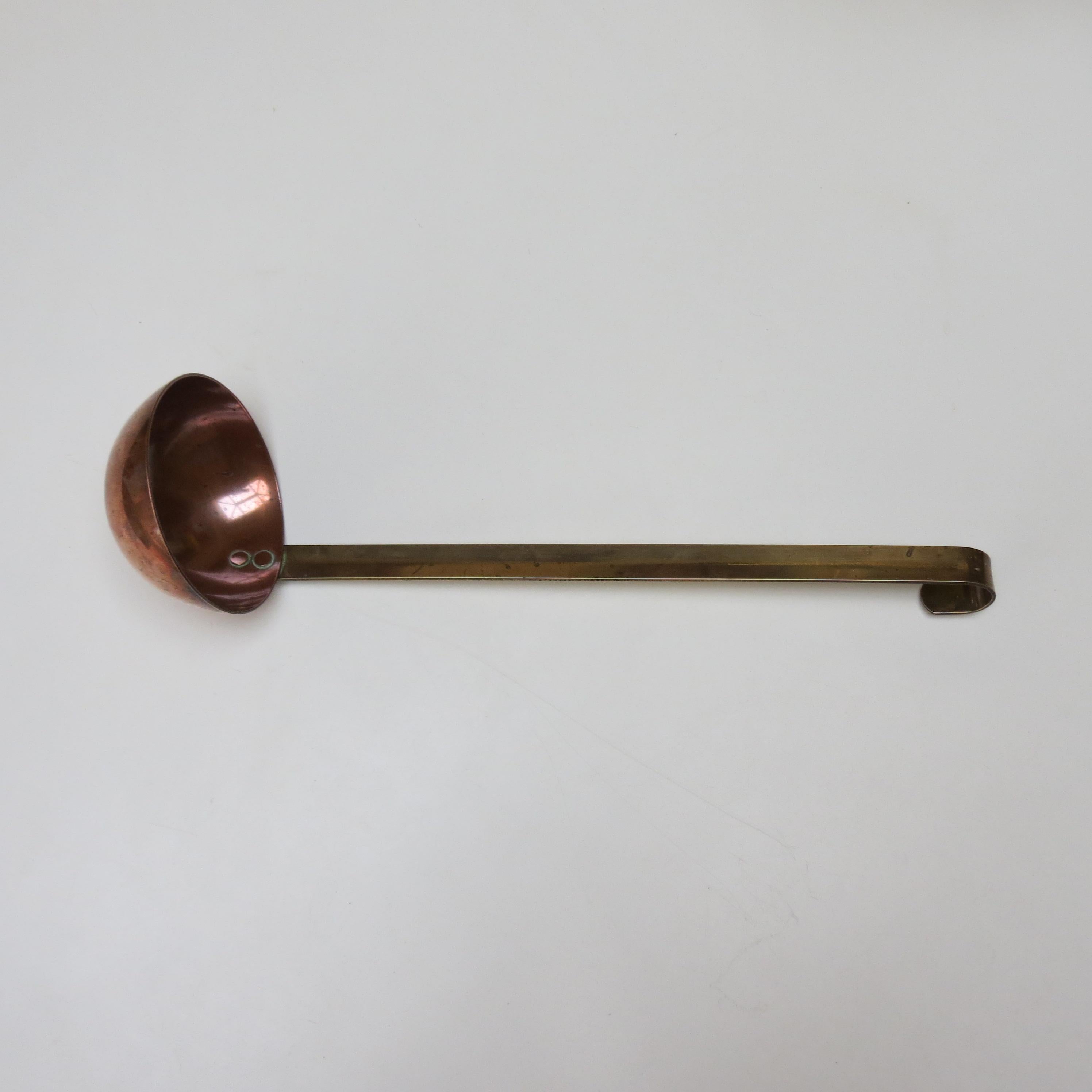 Wonderful, good quality, nicely weighted soup ladle. Very nicely made, rivets to scoop and handle, hook to the top of the handle allows the ladle to be hung.  
Nice patina all over.  Lovely weight to the ladle.

ST1561