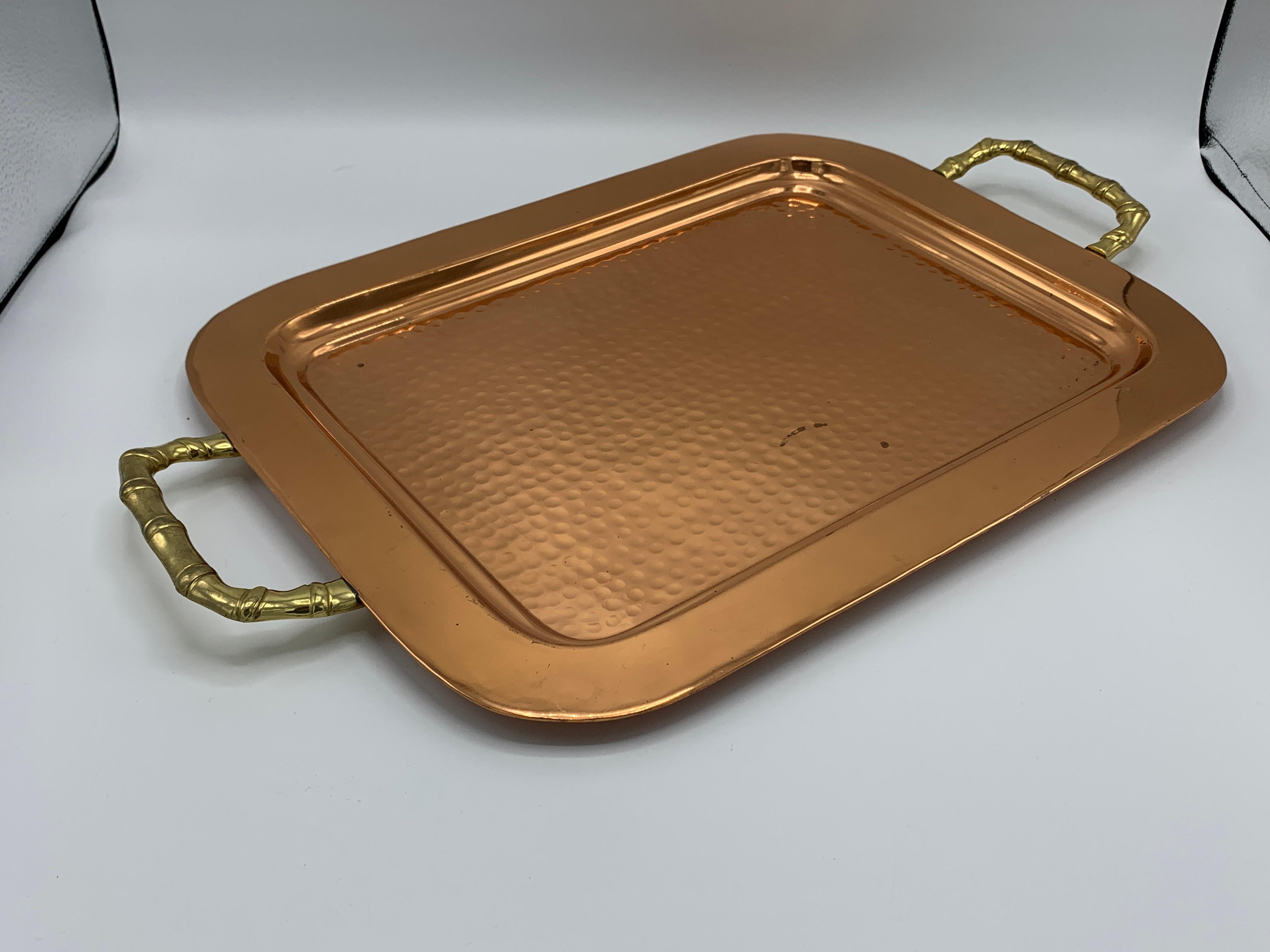 Offered is a stunning, 1970s hammered-copper tray with thick brass faux-bamboo handles. Heavy, 3.5lbs.
