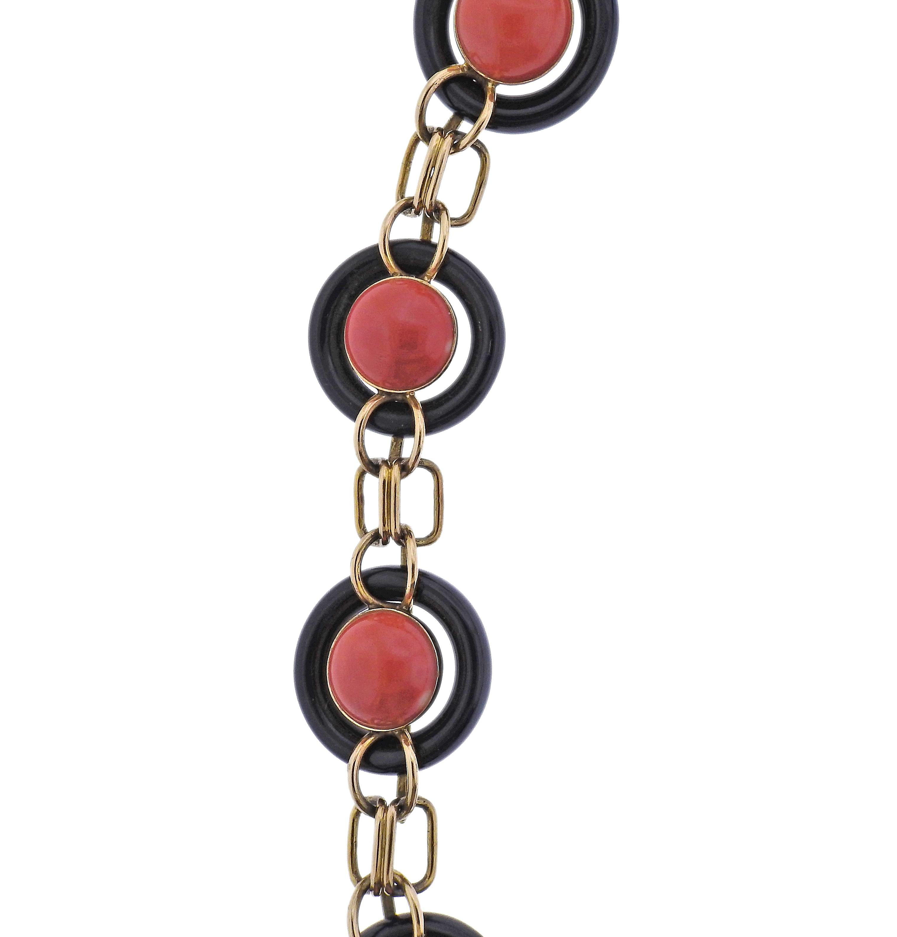 1970s 14k gold link necklace, with onyx and coral. Each link is 22mm in diameter, coral stones are 11mm in diameter. Necklace is 24