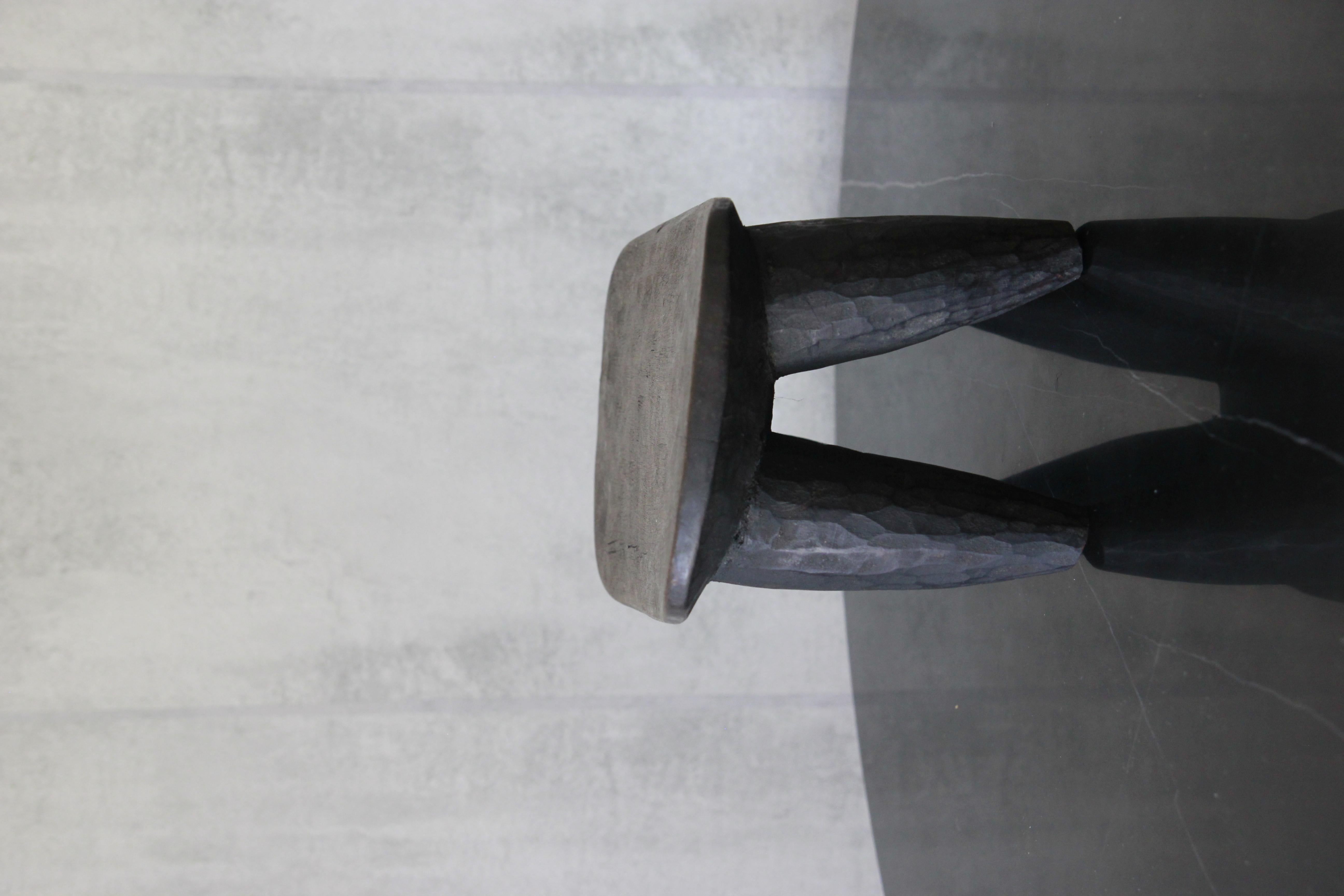 African Senufo milk stool on four tapered legs with an abstract form. 

Abstract and geometric patterns integrated in their design, heavy shaped legs Carved from one piece of wood.

Senufo designs are popular for their elegance and beauty.